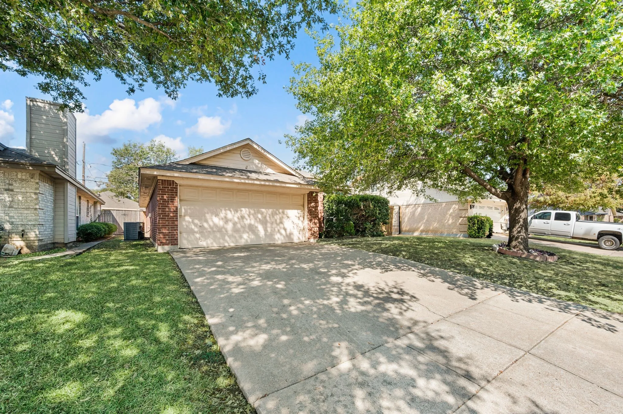 Spacious driveway leads to the convenient two-car garage.