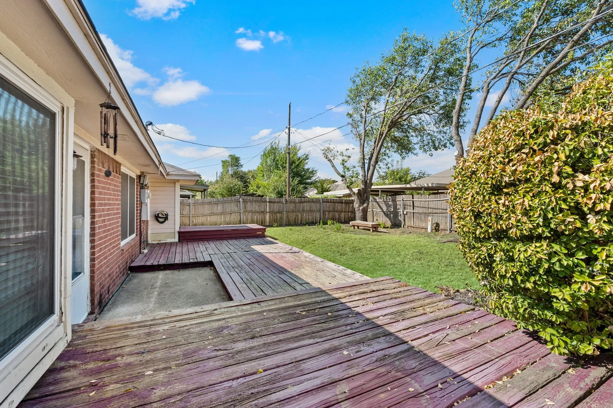 Expansive backyard deck offers plenty of space for outdoor dining, grilling & entertaining.