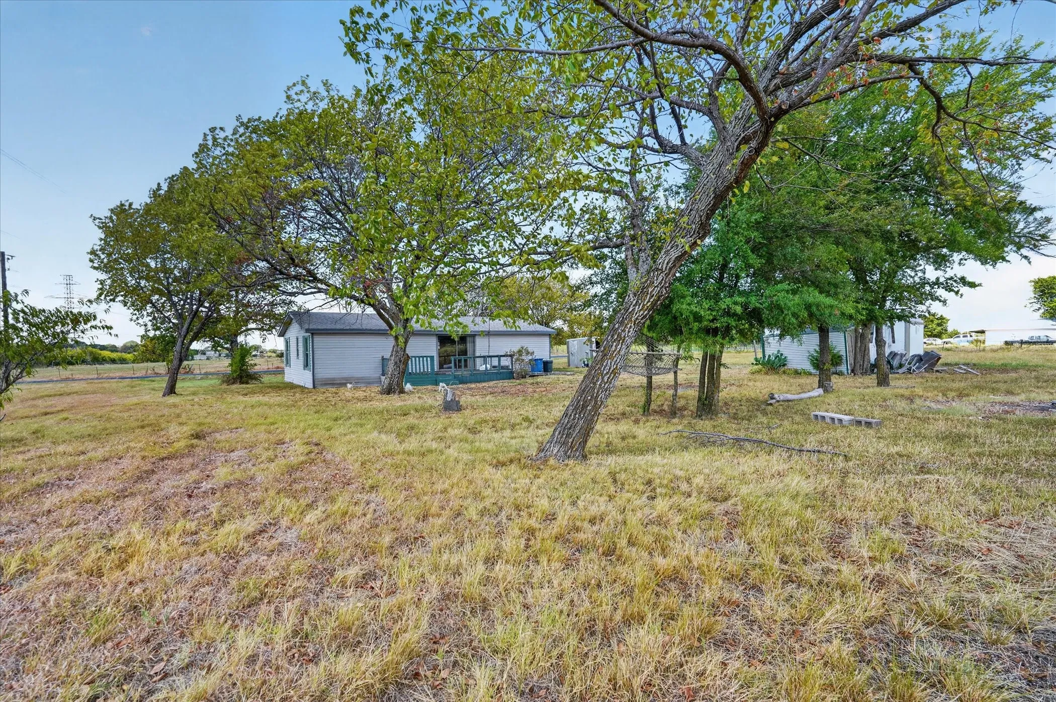 Expansive lot with mature trees and a rear deck