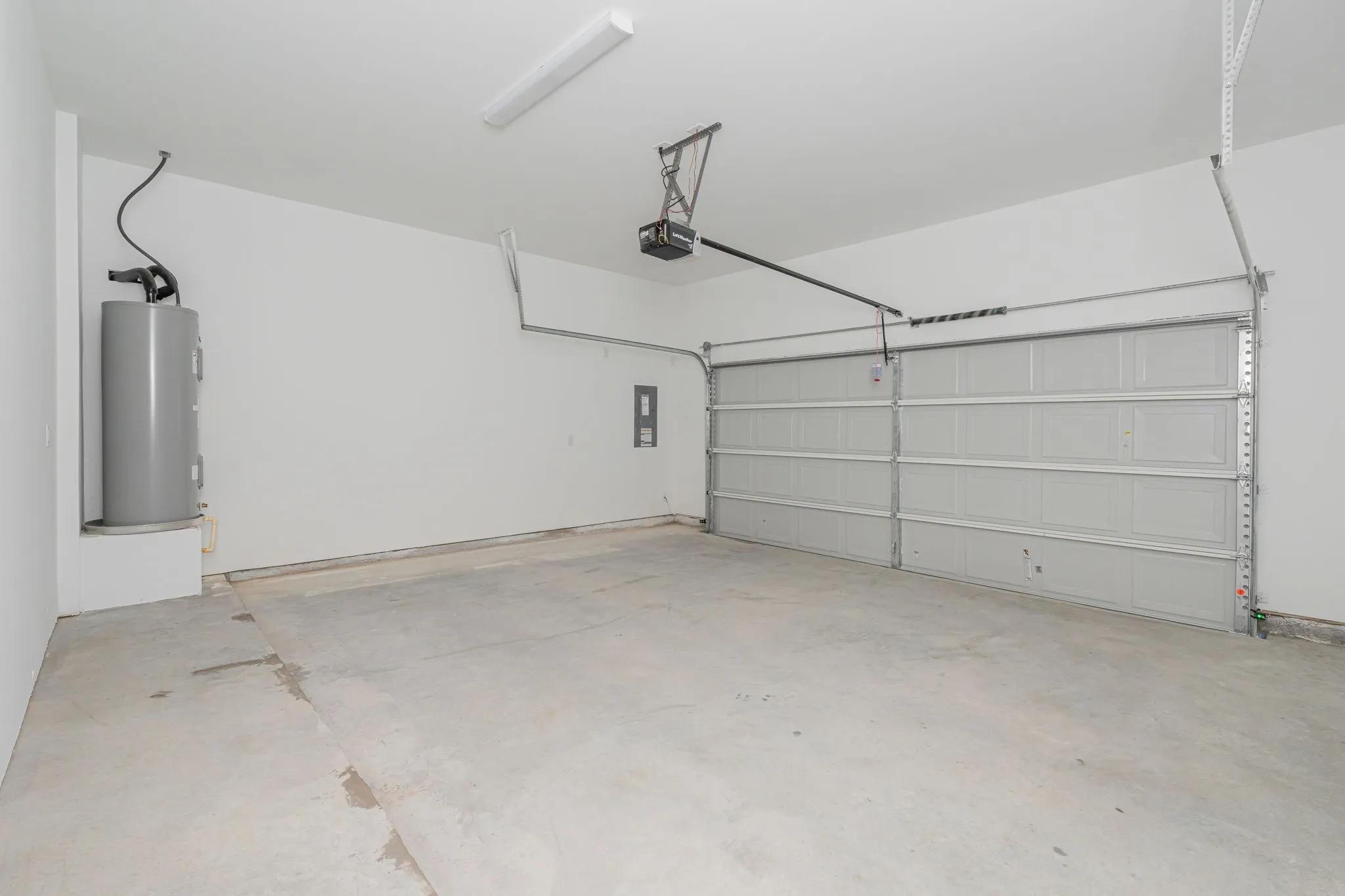 Generous two-car attached garage provides ample room for vehicles, storage, and additional workspace, with an automatic garage door opener.