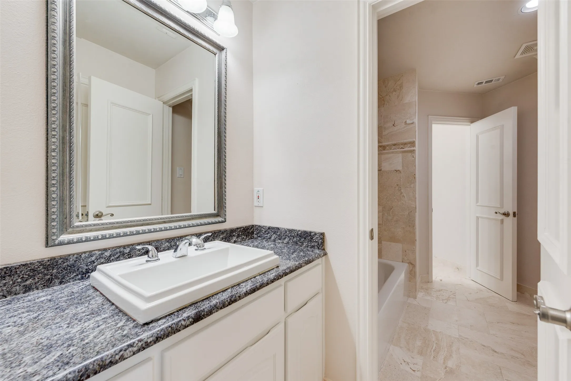 JACK AND JILL 2ND FLOOR TRAVERTINE FLOORS AND SHOWER