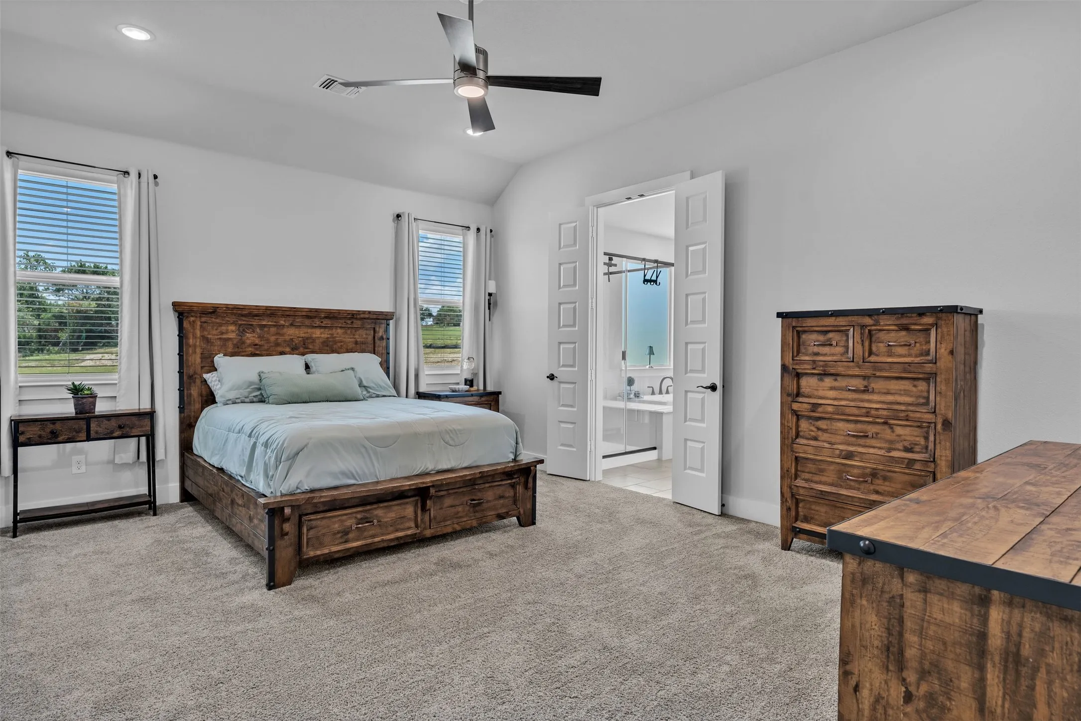 Vaulted ceiling featuring a ceiling fan and recessed lighting