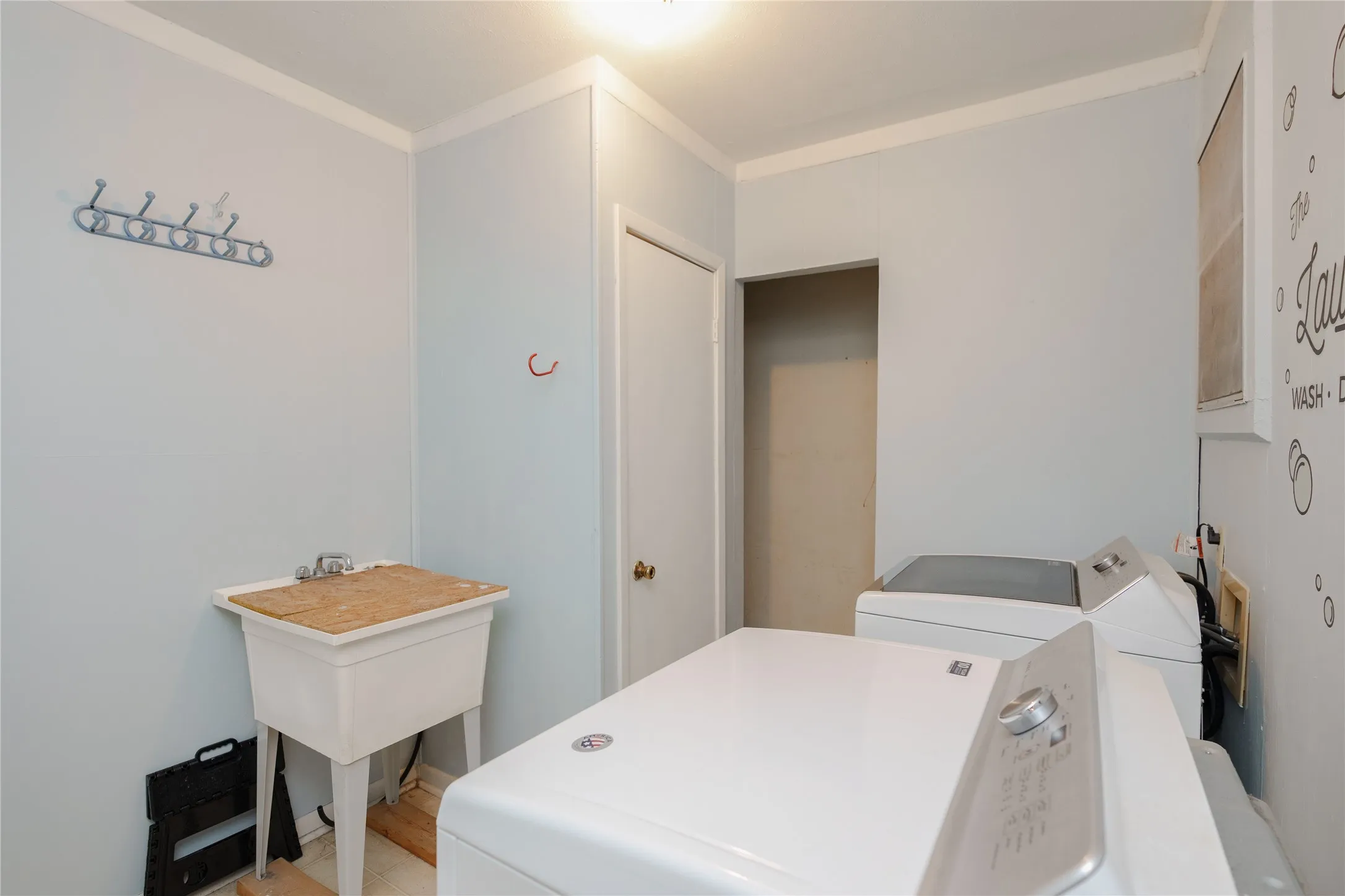 Utility sink and bright white walls