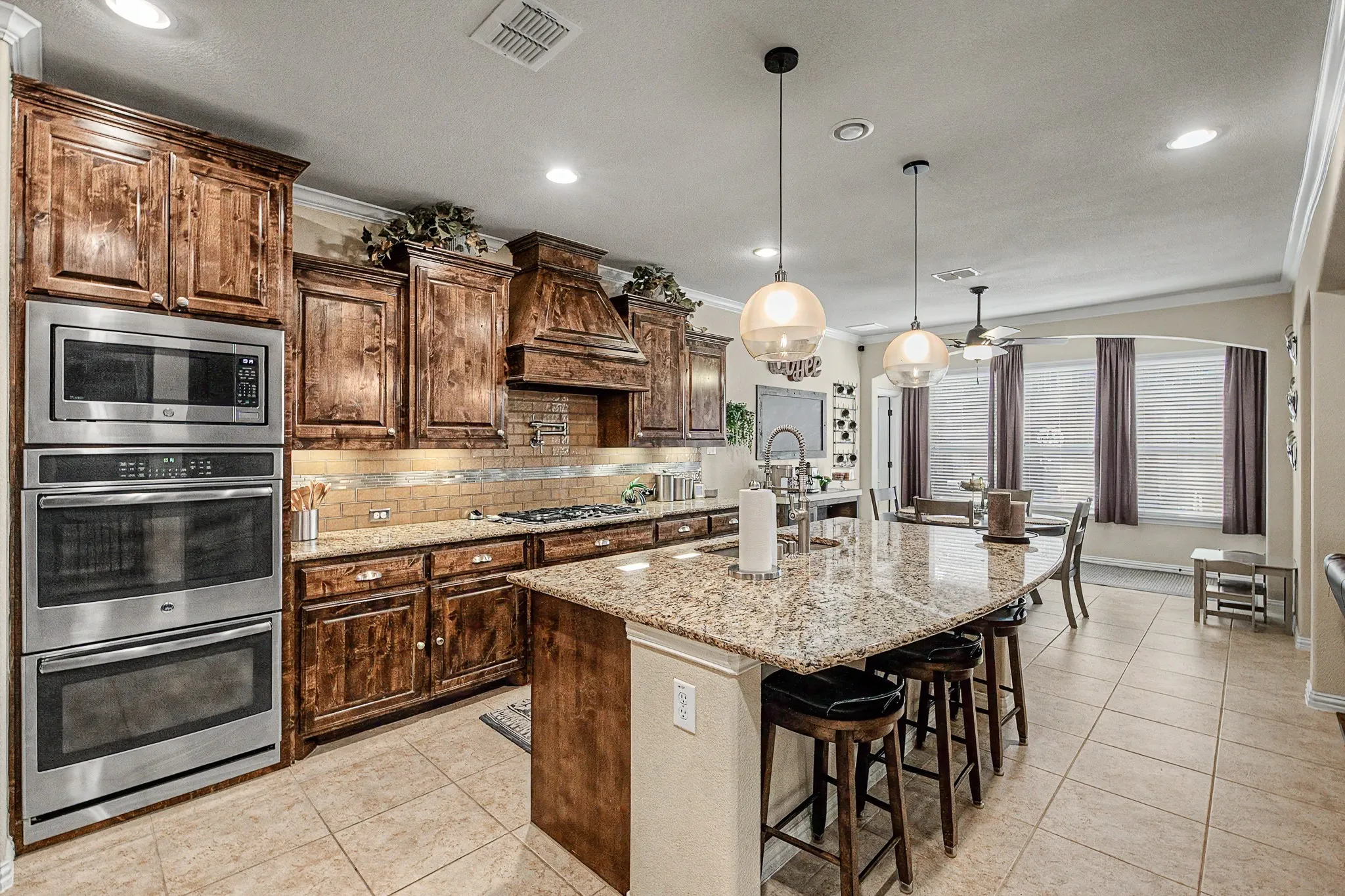 Eat-in Kitchen with Island, double ovens, gas cooktop and lots of storage!