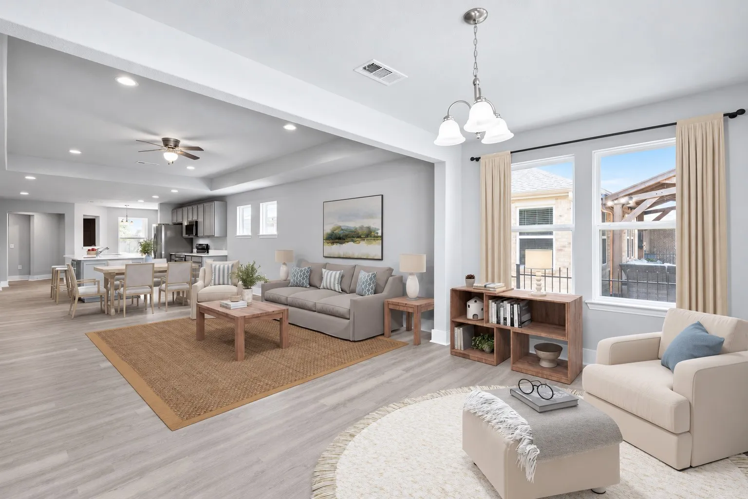 Sunroom opens to spacious living room and dinin area. The spaciousness of this plan is what makes it so great! Sunroom, Living Area PLUS Dining Area. Virtually staged to show potential furniture placement.