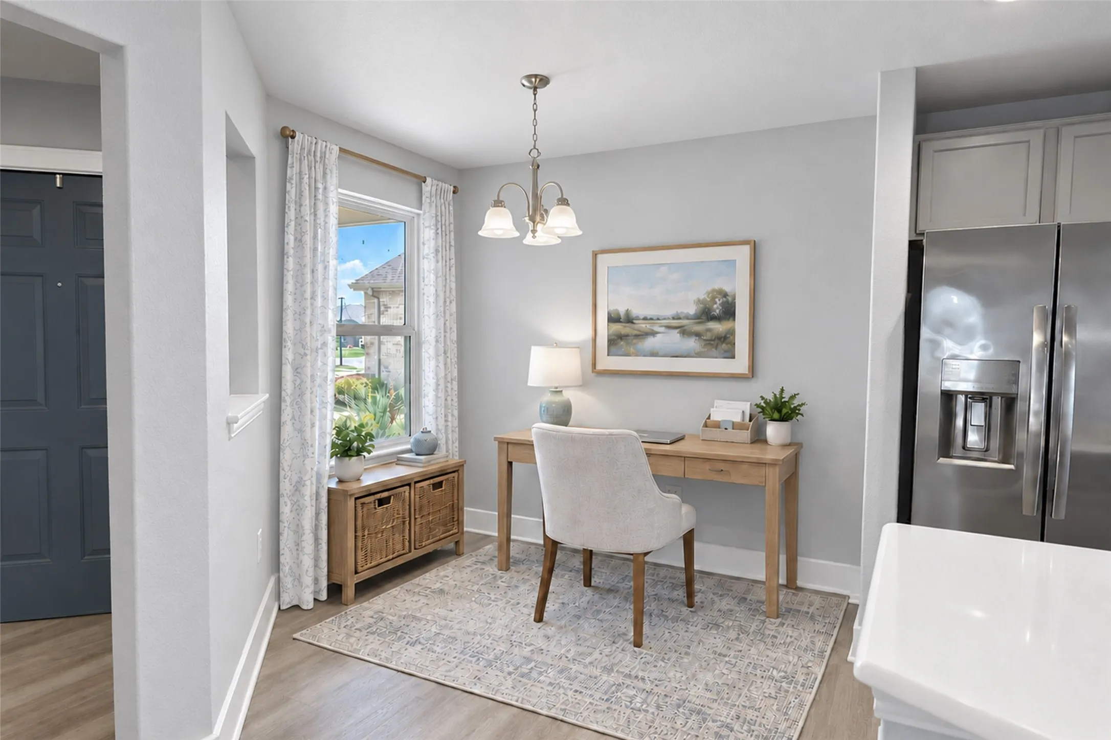 Versatile space you can use as a breakfast nook or as a home office or hobby space, since you have room for a full dining table in another room, plus bar stools at the oversized kitchen island. Virtually staged to show potential design options.
