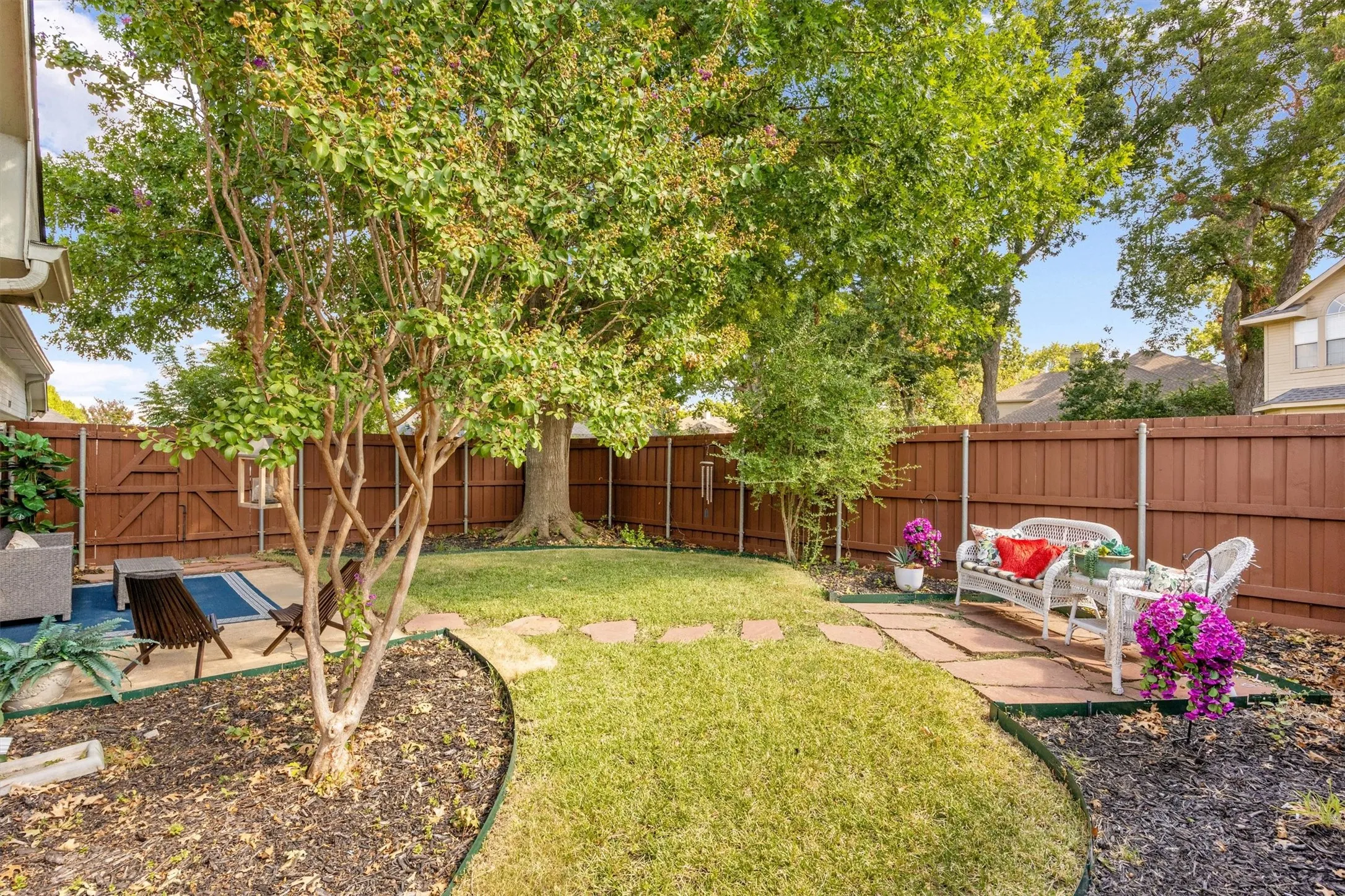 Mature shade tree, storage shed, fully enclosed privacy fence