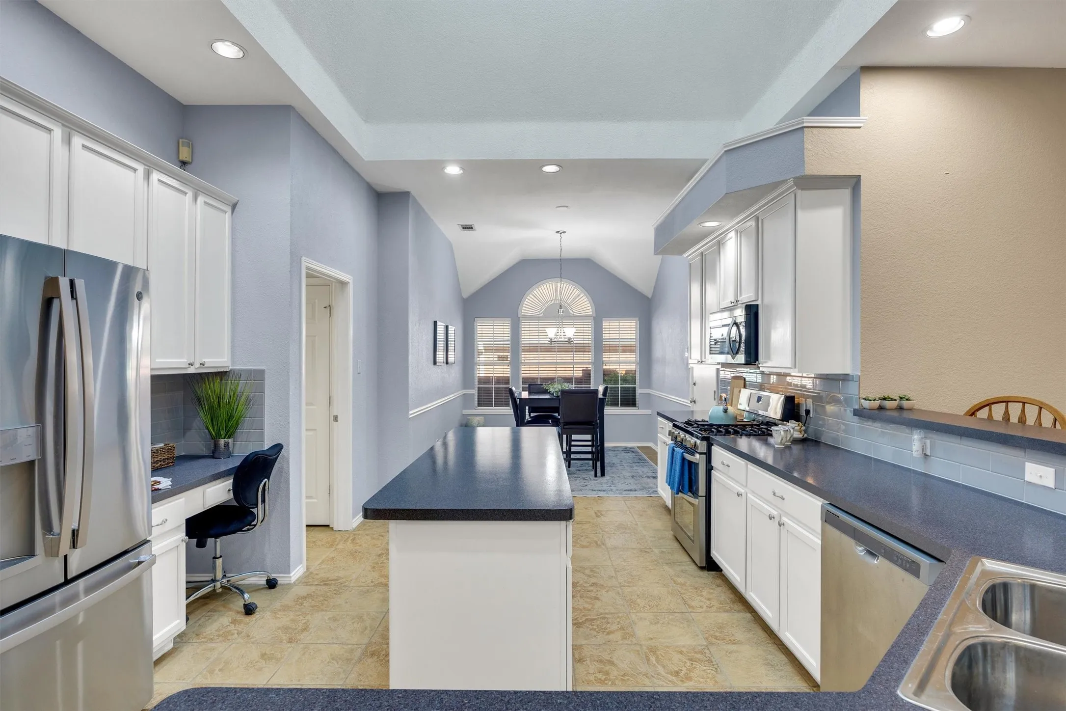 Open kitchen complete with skylight and breakfast room