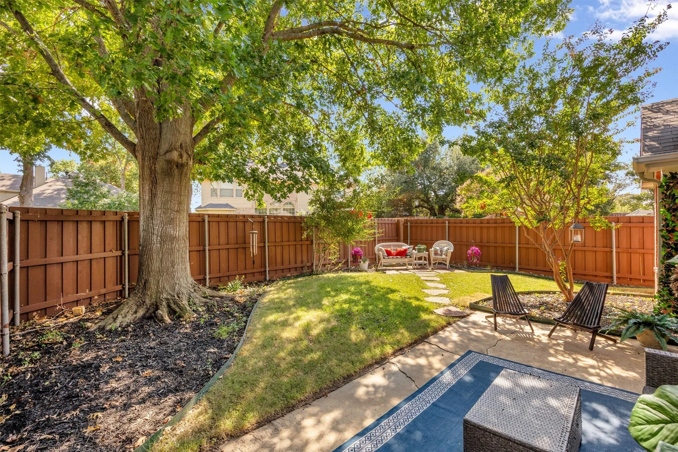 Mature shade tree, storage shed, fully enclosed privacy fence