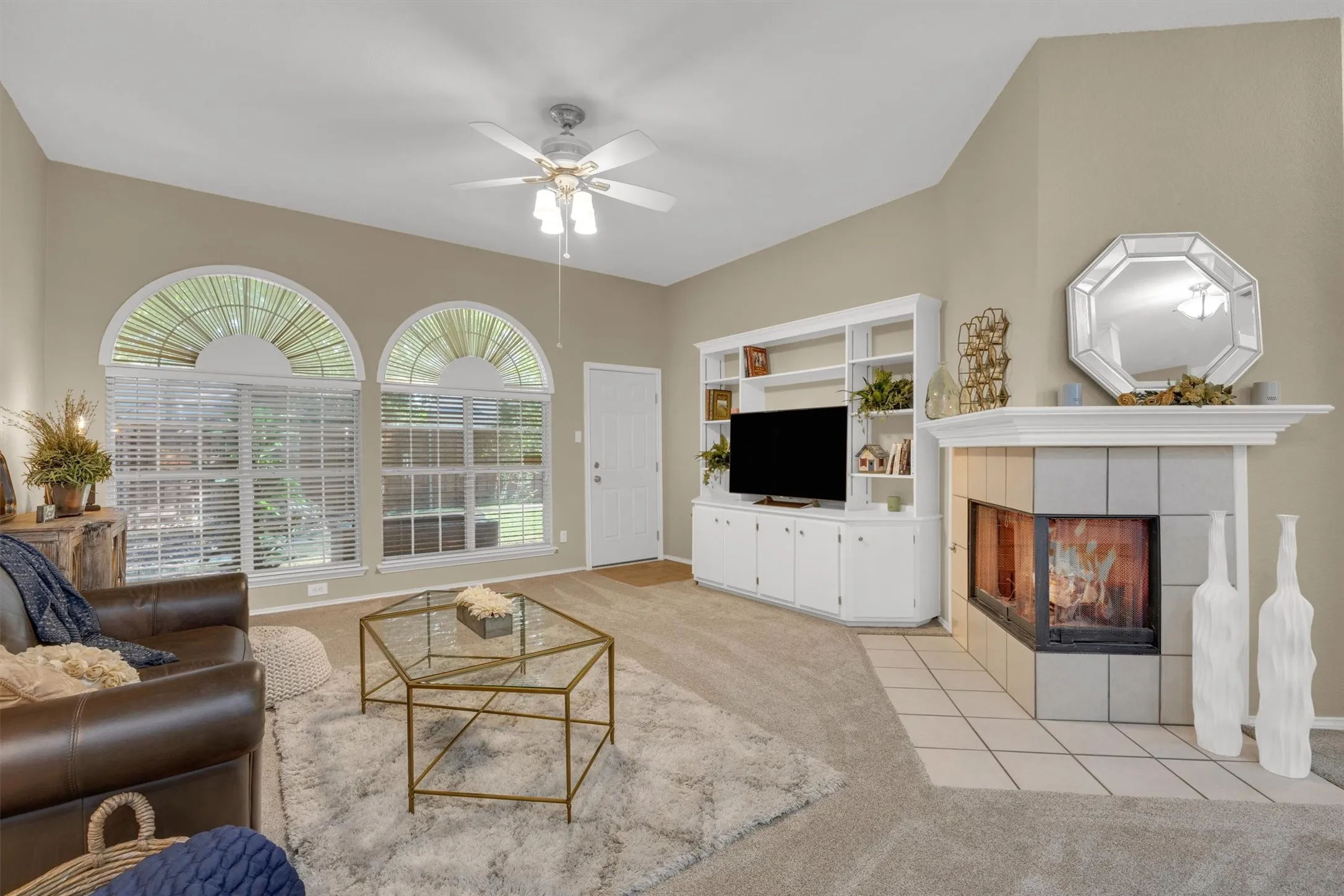 Living with built in cabinets, see thru fireplace