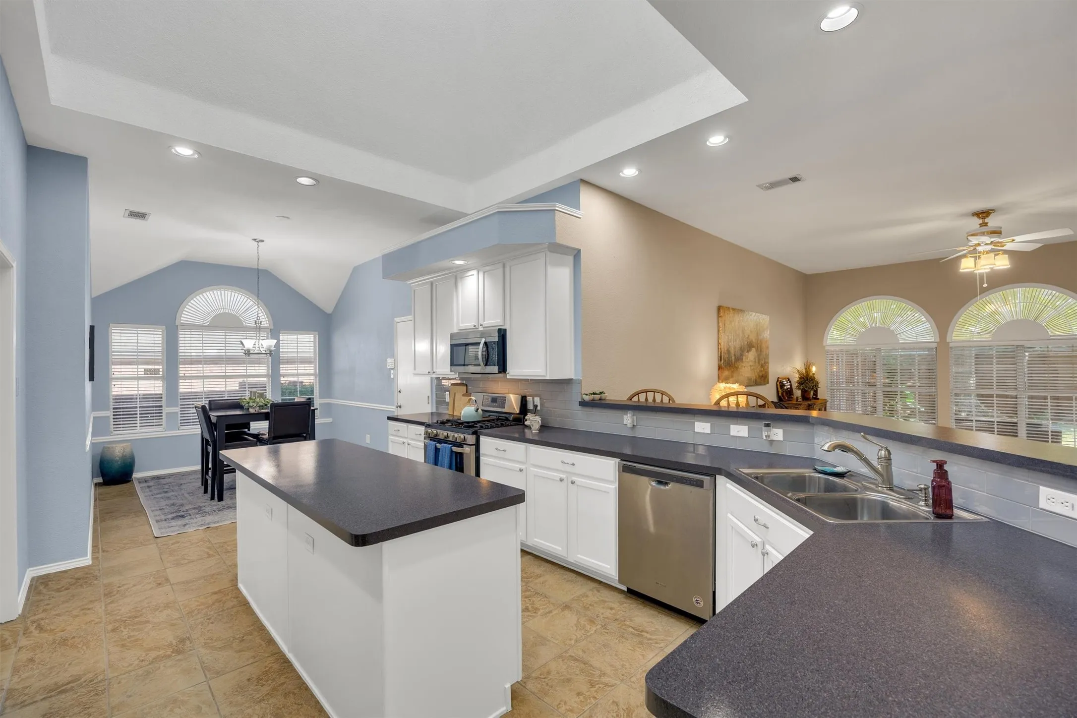 Open kitchen complete with skylight and breakfast room