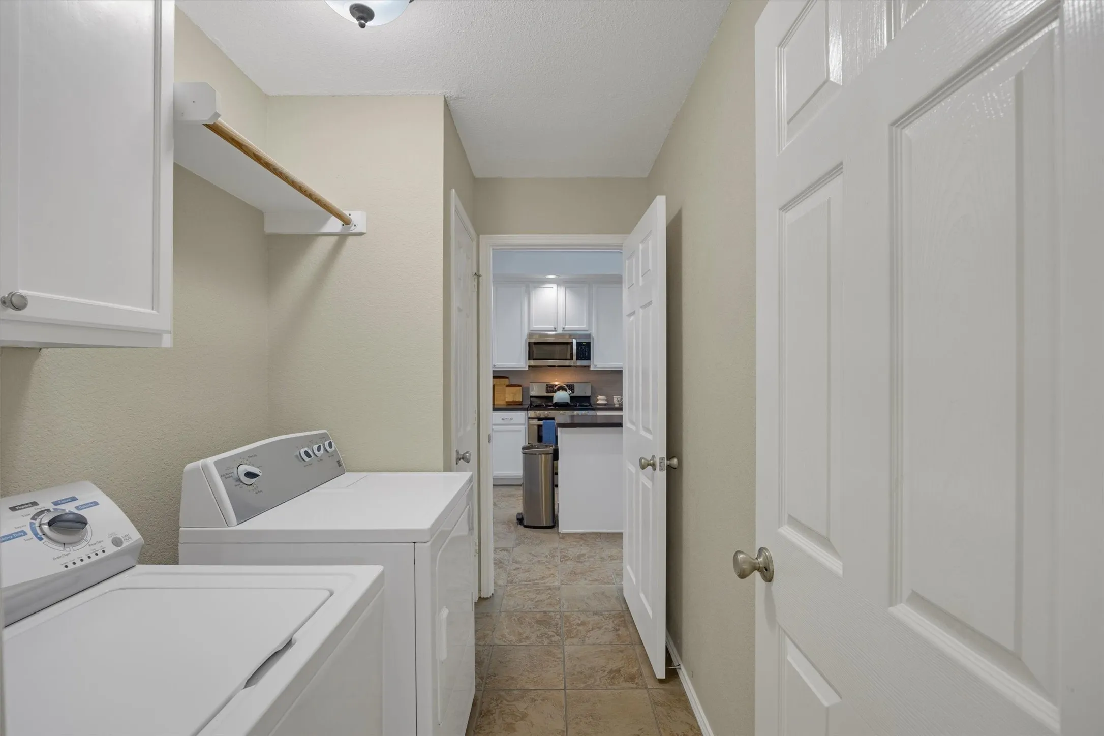 Full size washer and electric dryer laundry room