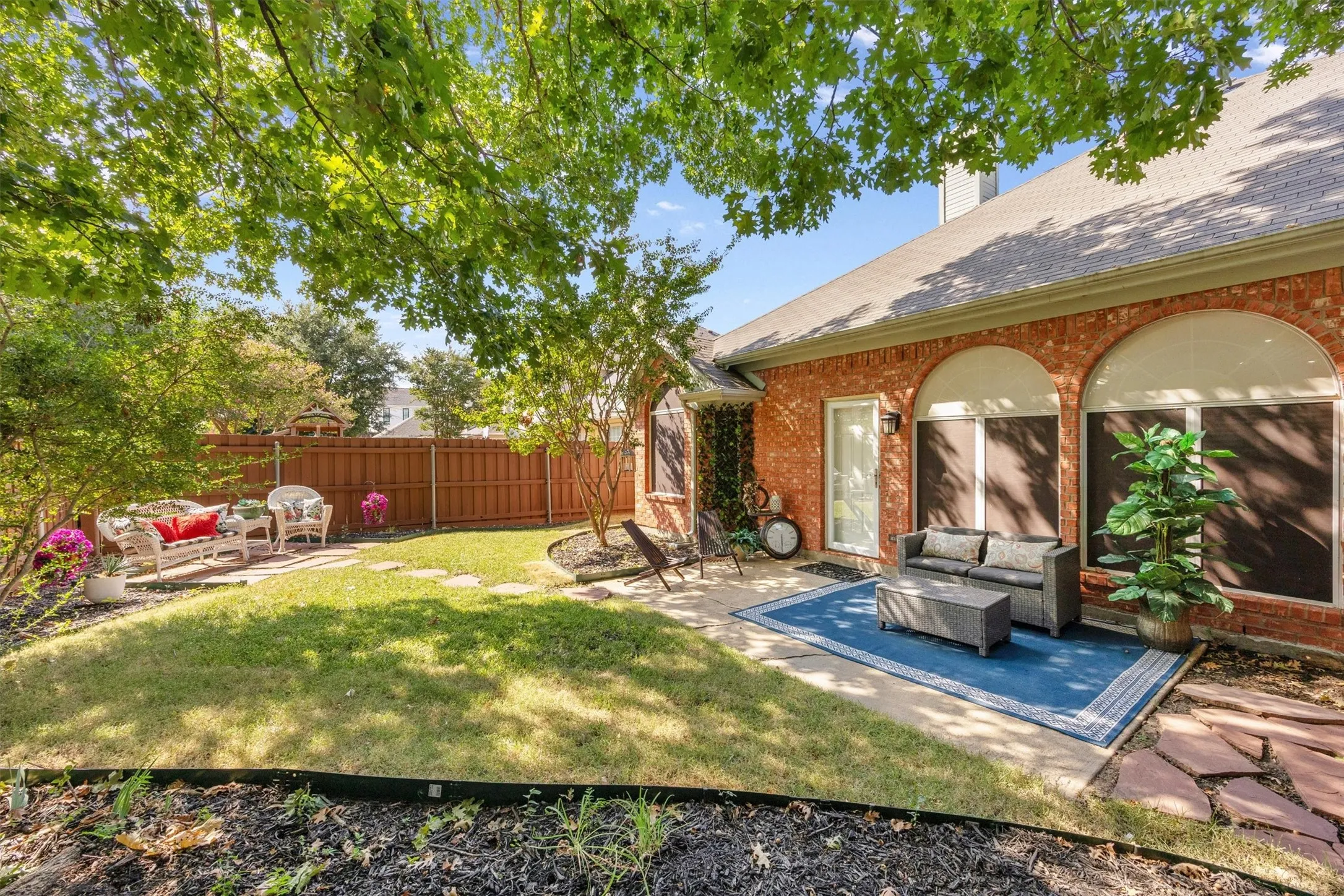 Mature shade tree, storage shed, fully enclosed privacy fence