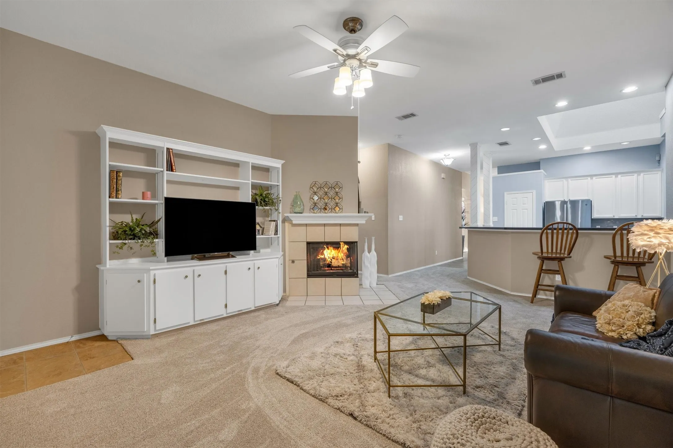 Living with built in cabinets, see thru fireplace