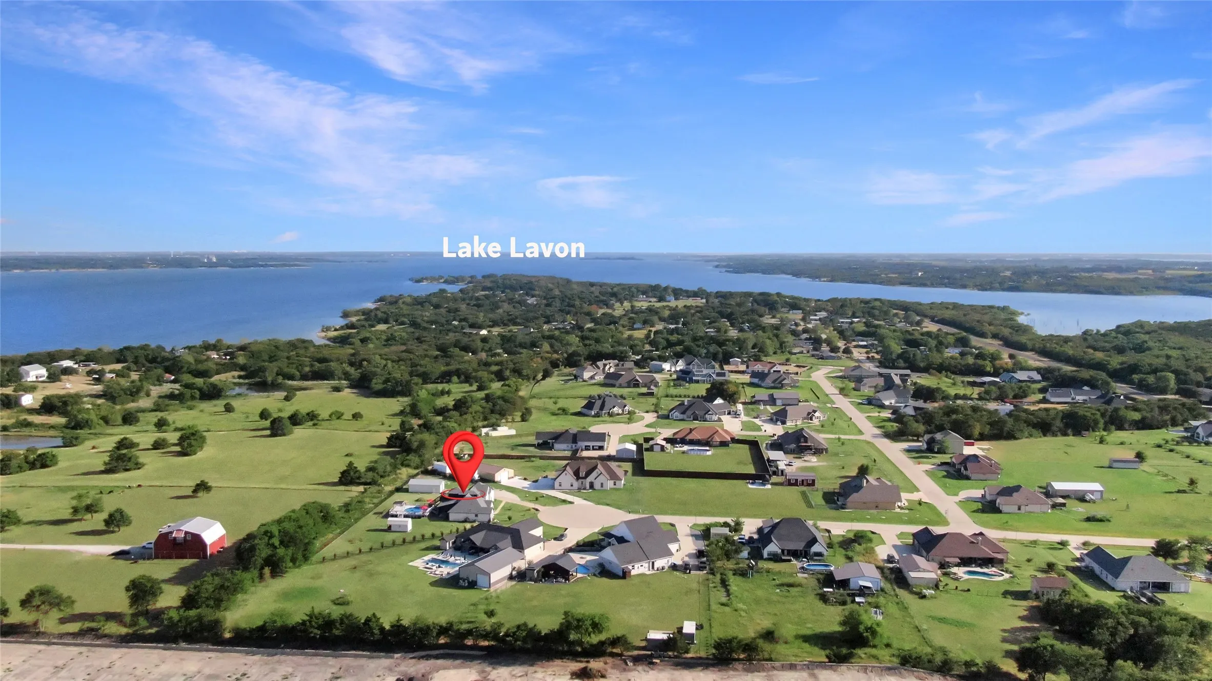 Expansive residential area with a prominent lake backdrop
