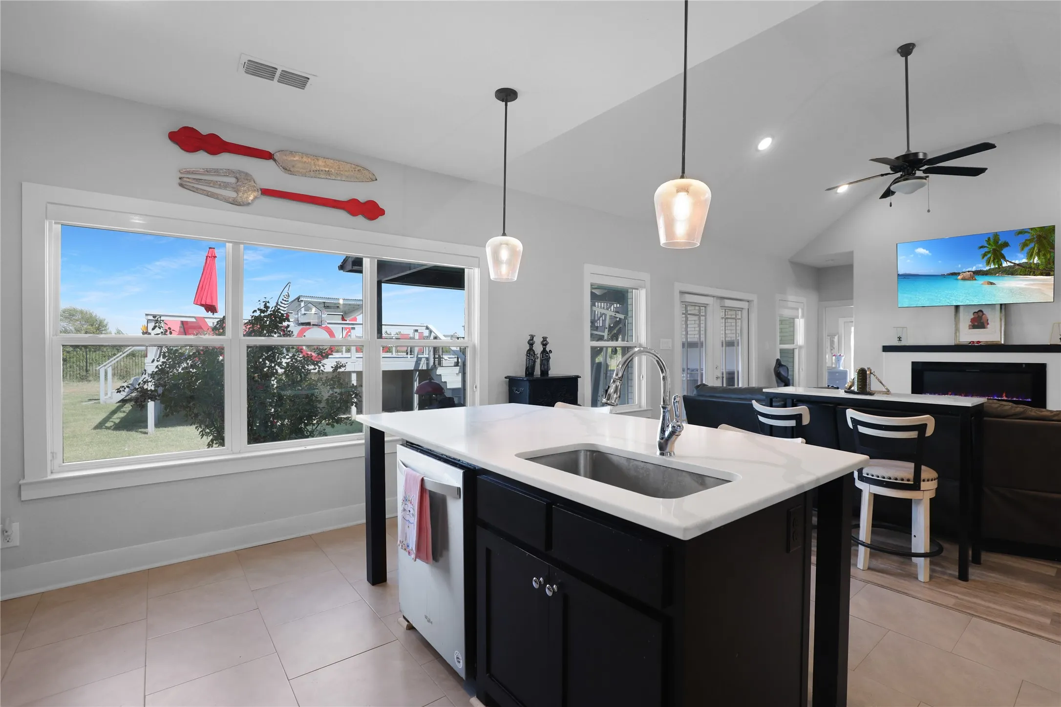Kitchen island with a built-in stainless steel sink and a white countertop