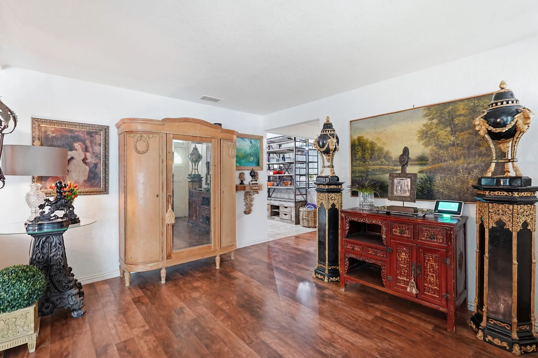 Room with wood-finish floor.