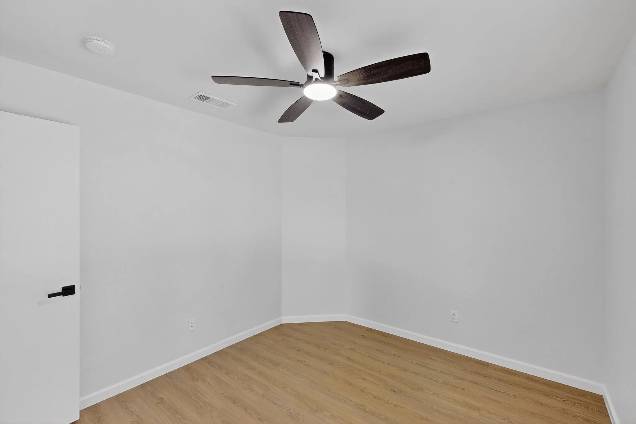 Recessed lighting and wood-finish flooring