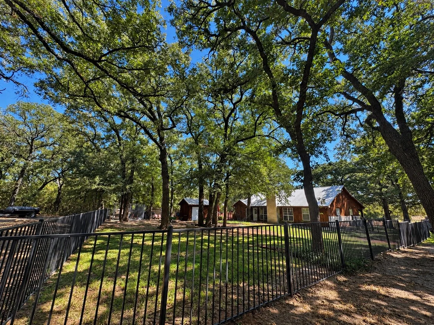 WROUGHT IRON FENCED BACK YARD