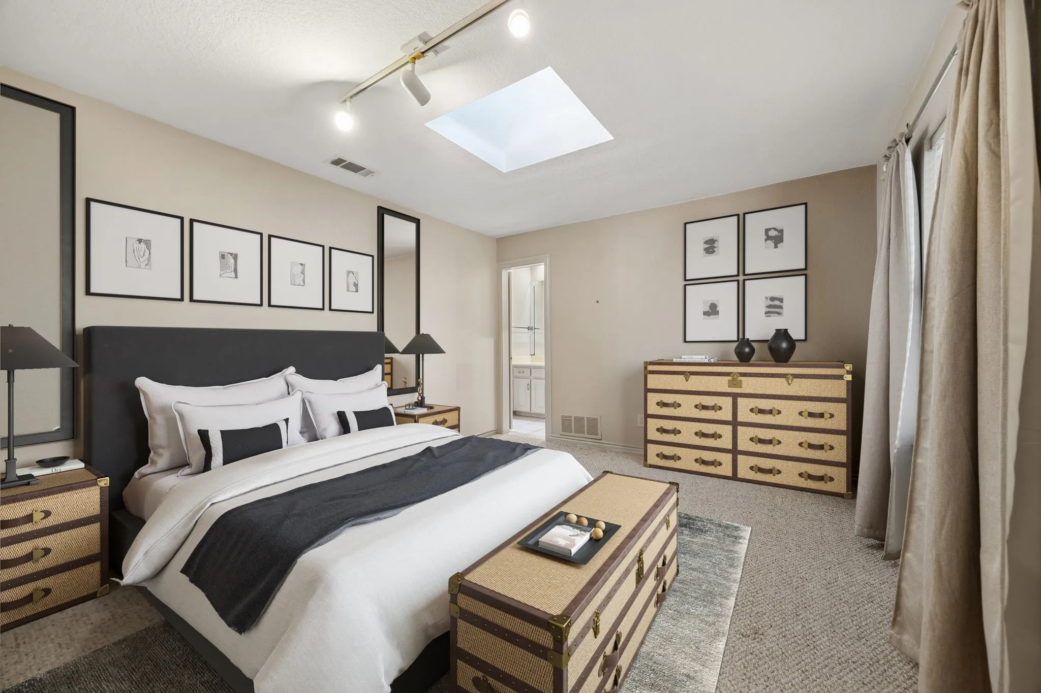 Recessed ceiling lighting, track lighting, and a skylight provide ambient illumination