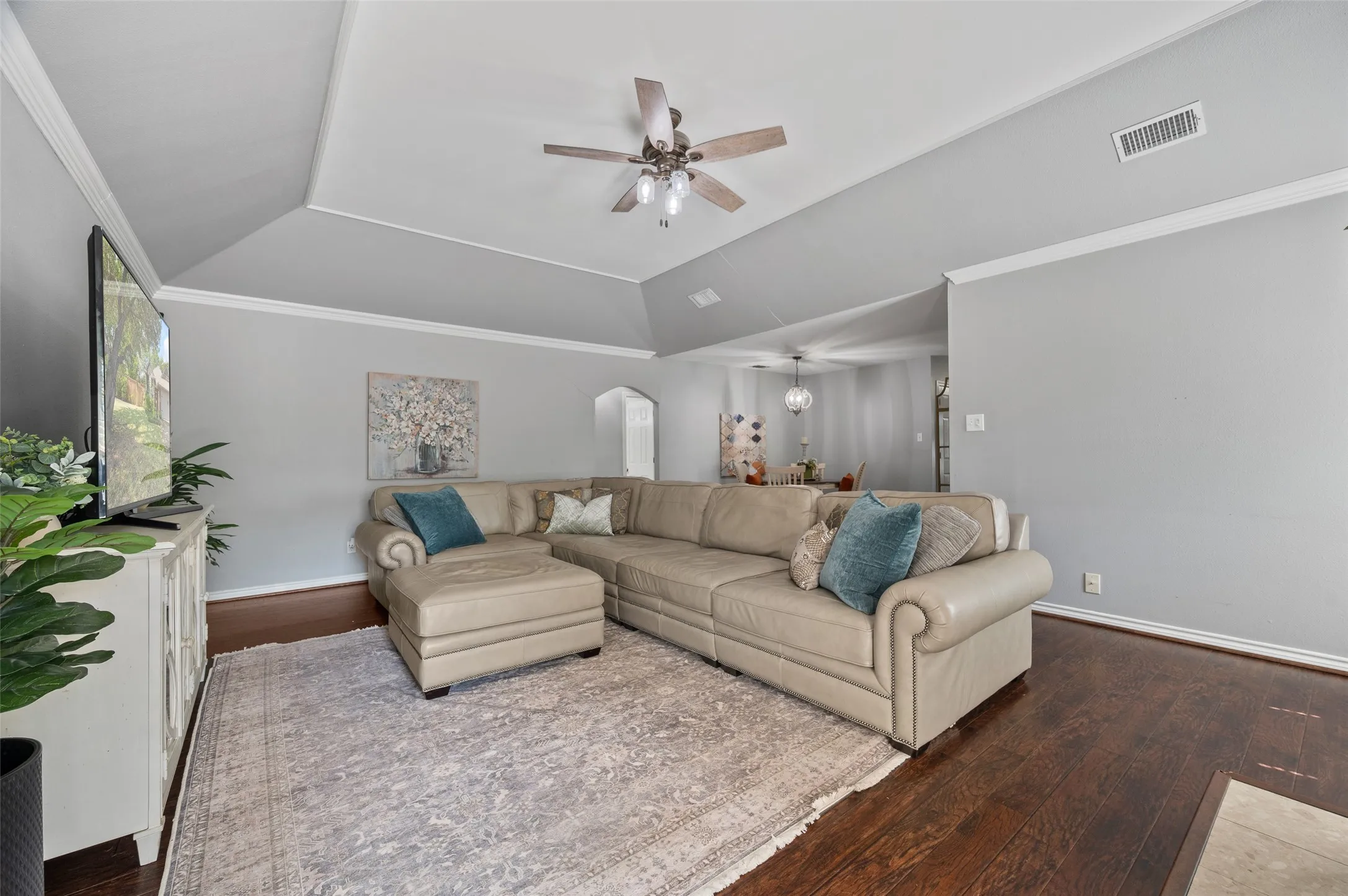Living room is open to the dining room which can be seen in the background.