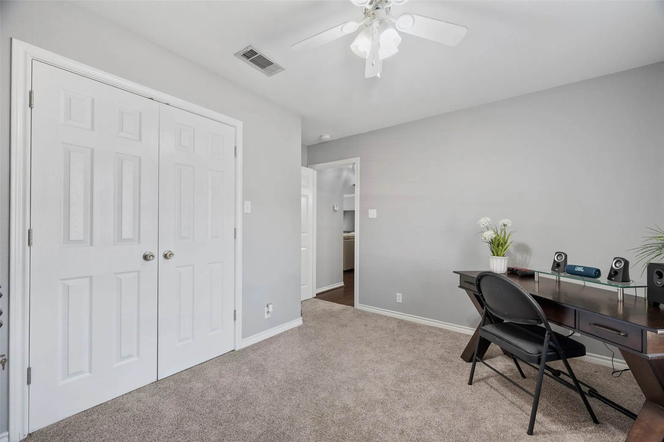 The third bedroom has it's own closet and ceiling fan and shares it's own private hallway and hallway bathroom with bedroom two.