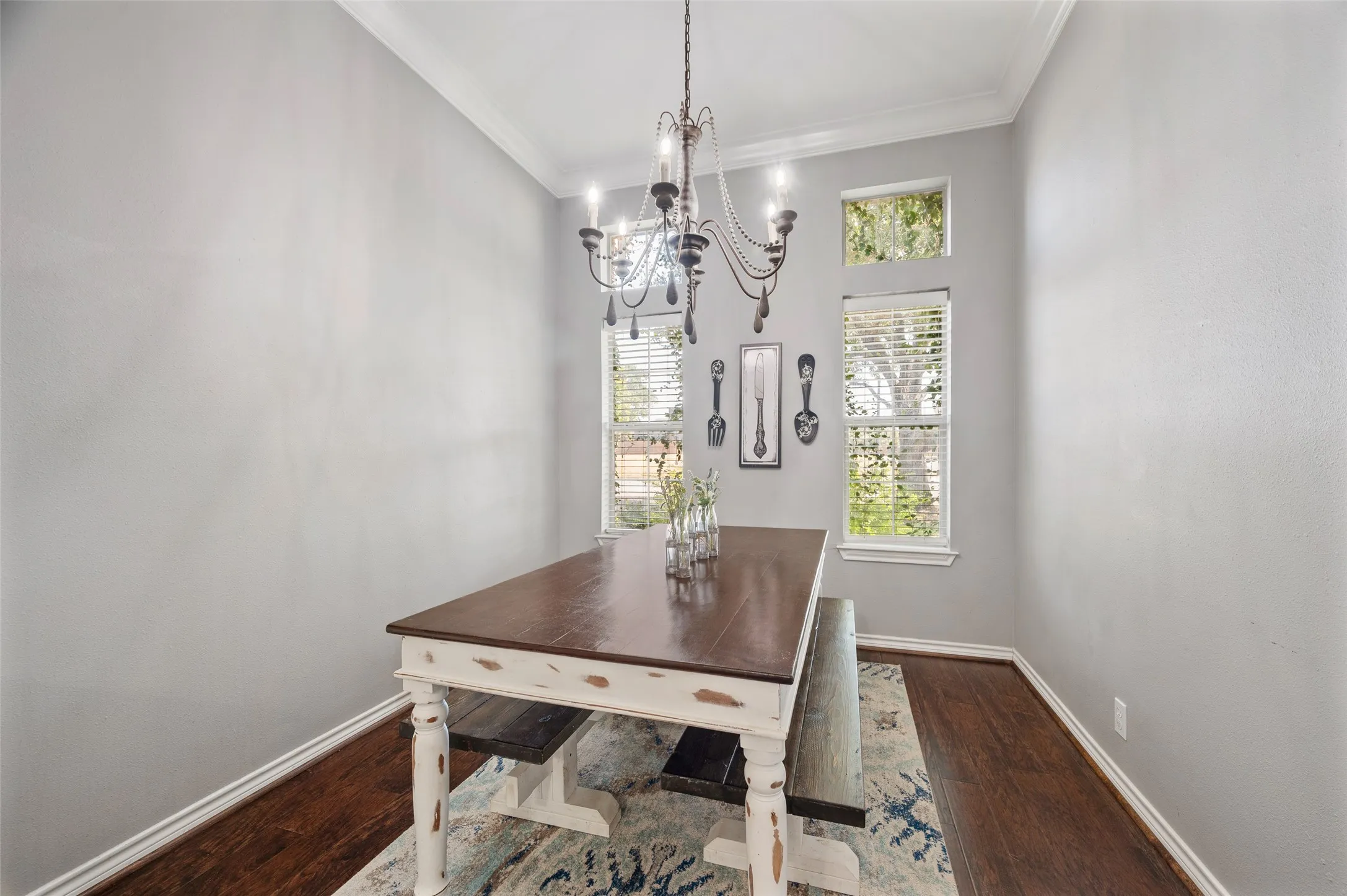 Enjoy the elegant second dining area located in the kitchen with the backdrop of sunshine filled windows that open up to the garden.