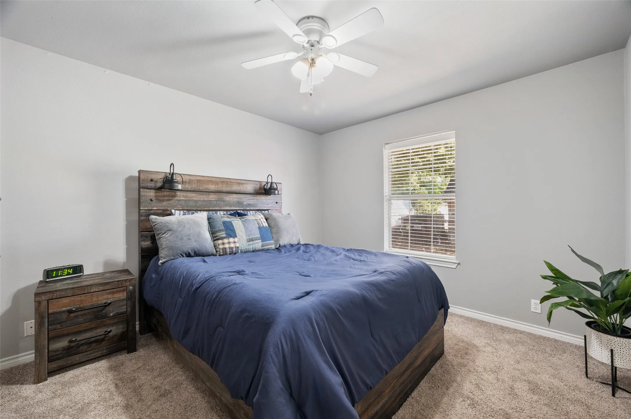 Second bedroom is a good size with its own closet and ceiling fan.