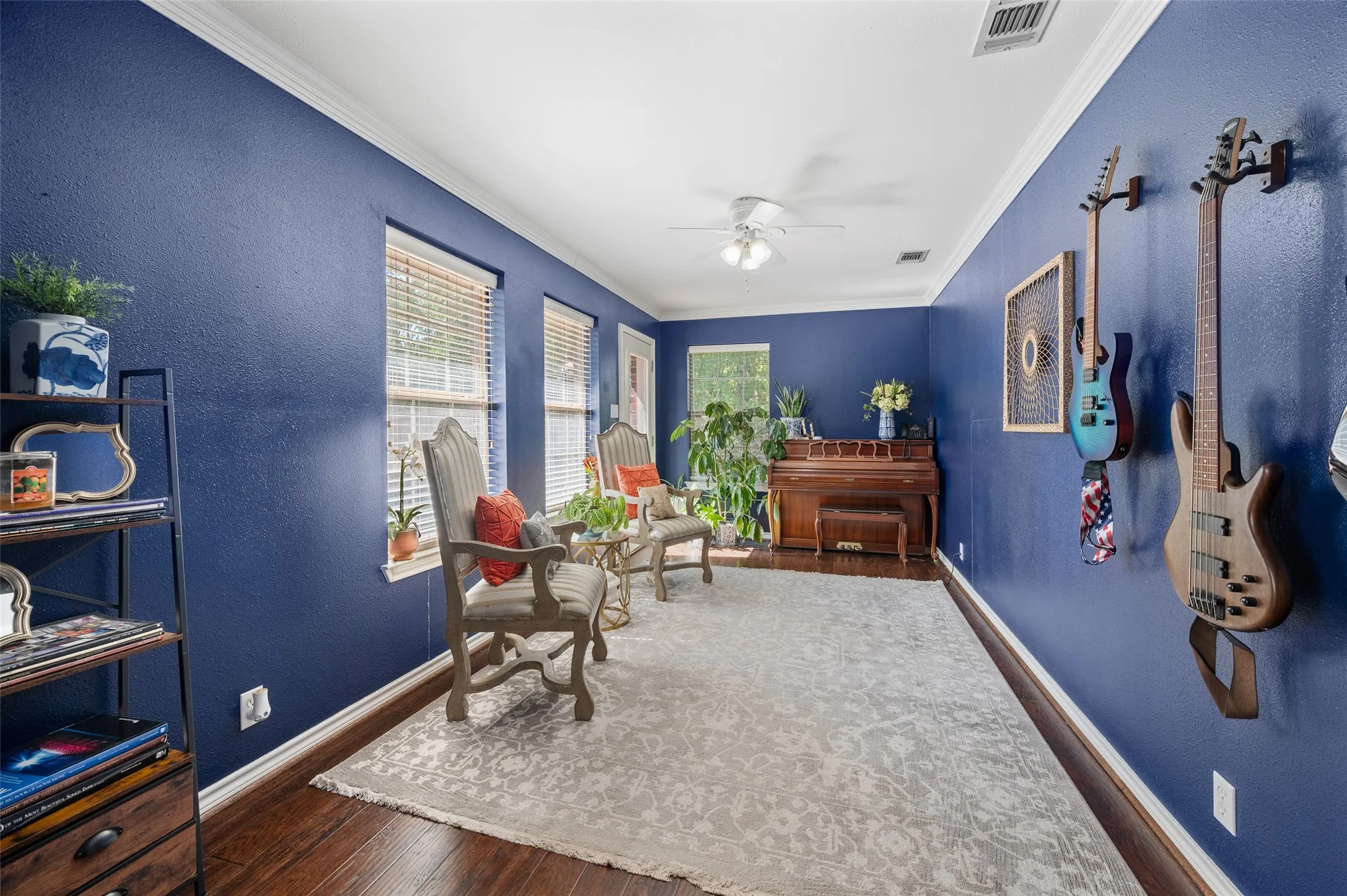 The den is a flex space on the back of the house that gives access to the backyard.  So many uses!!!  Here you see it as a music room but it could also be an exercise room, yoga and meditation room, playroom, office, library and more.