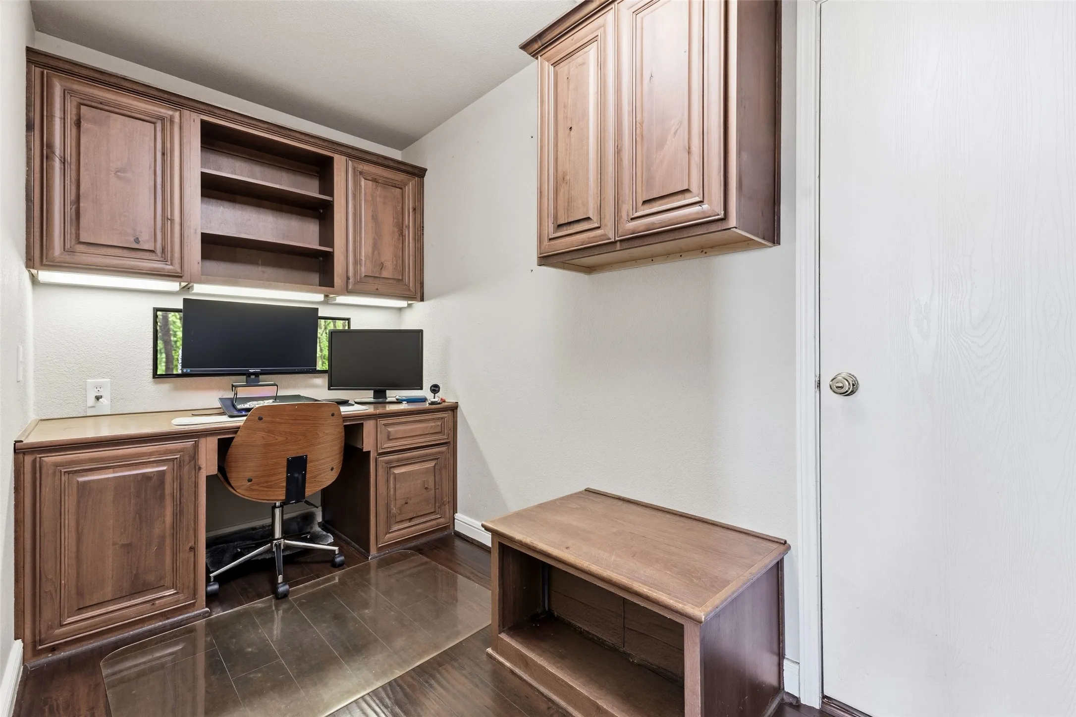 The huge laundry room has a built-in desk for a private office space