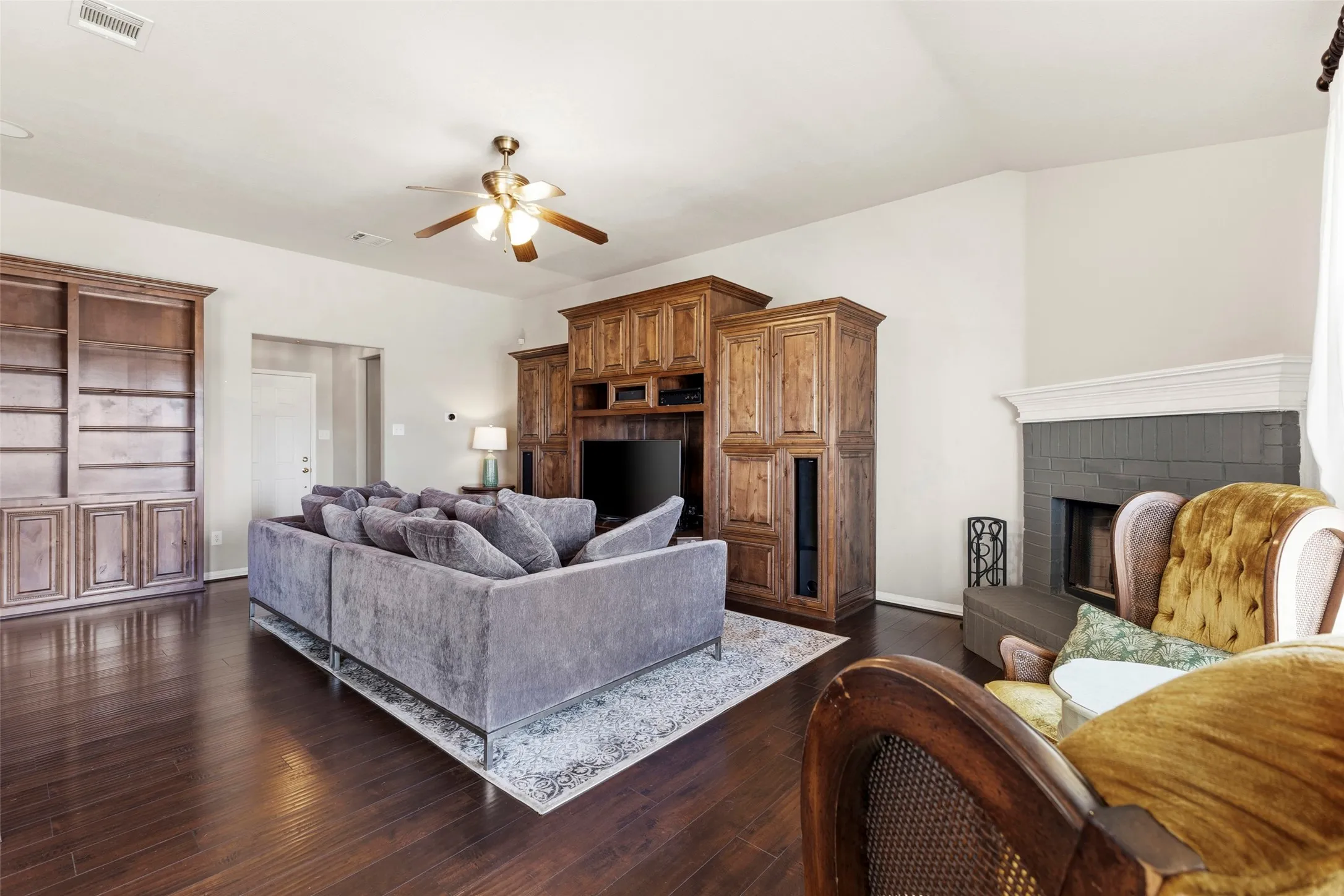Large living room with tall ceilings and fireplace