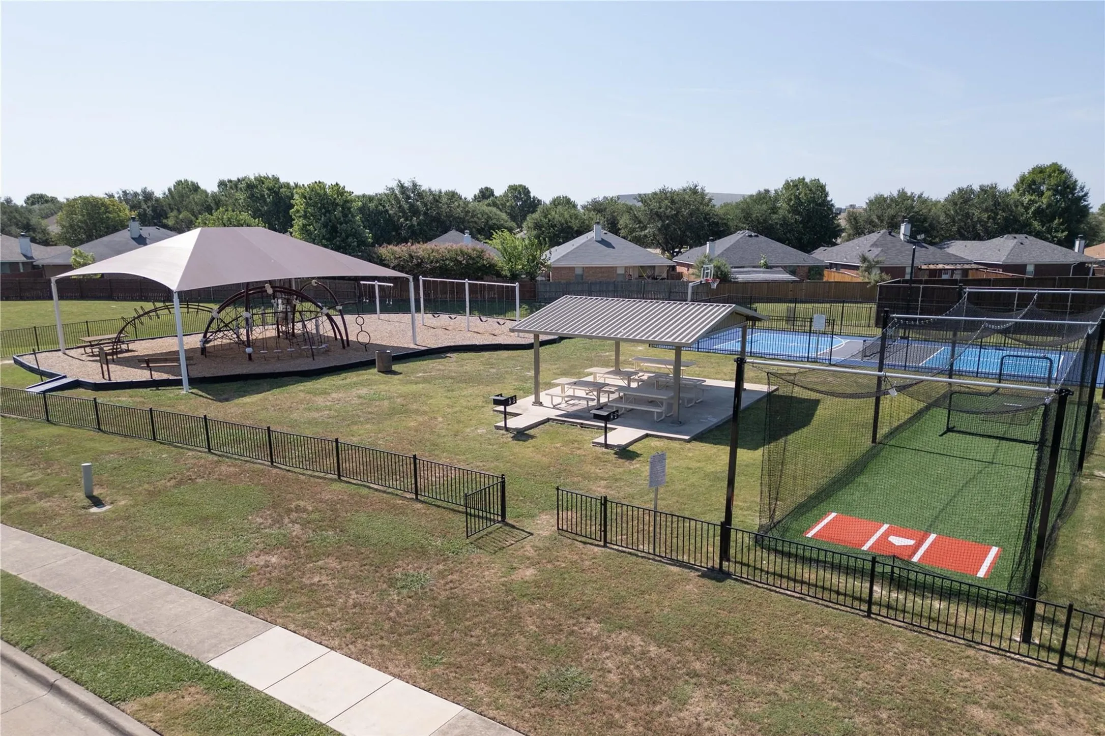 Community playground, pickleball court, basketball court and batting cage