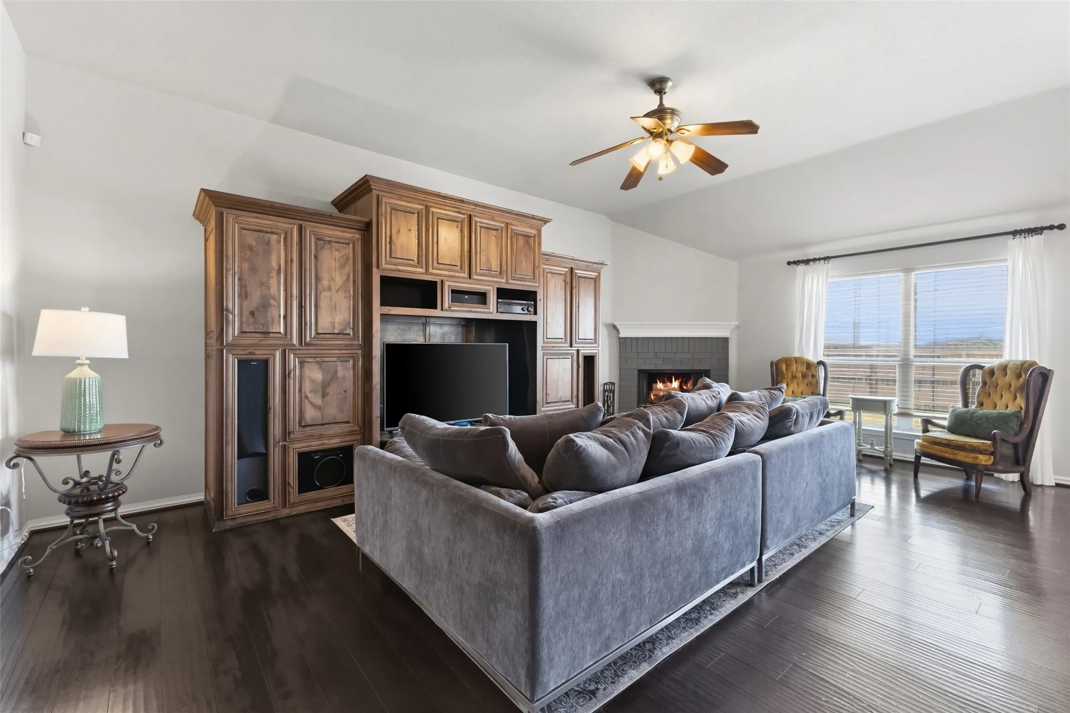 Large living room with tall ceilings and fireplace