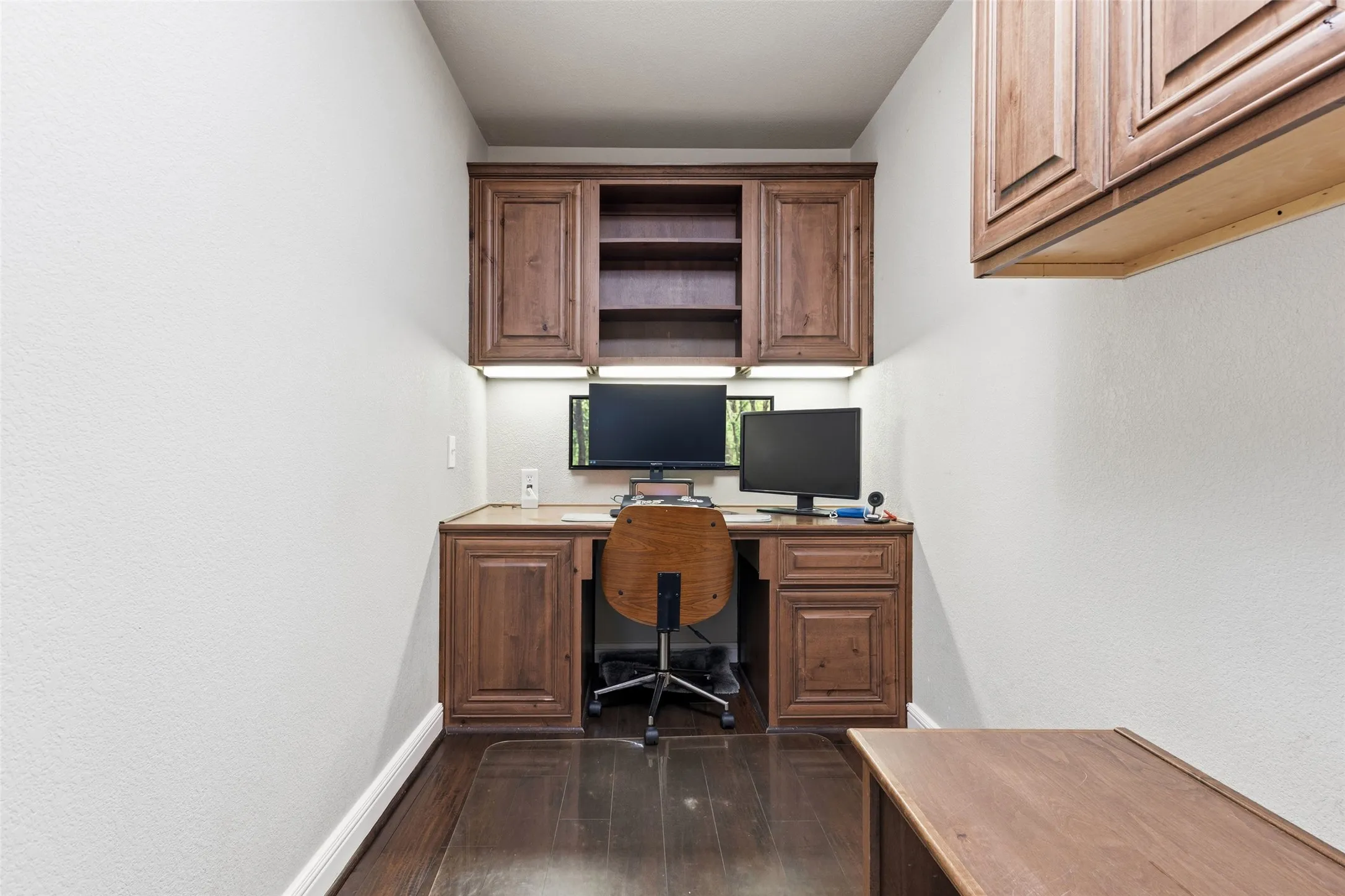 The huge laundry room has a built-in desk for a private office space