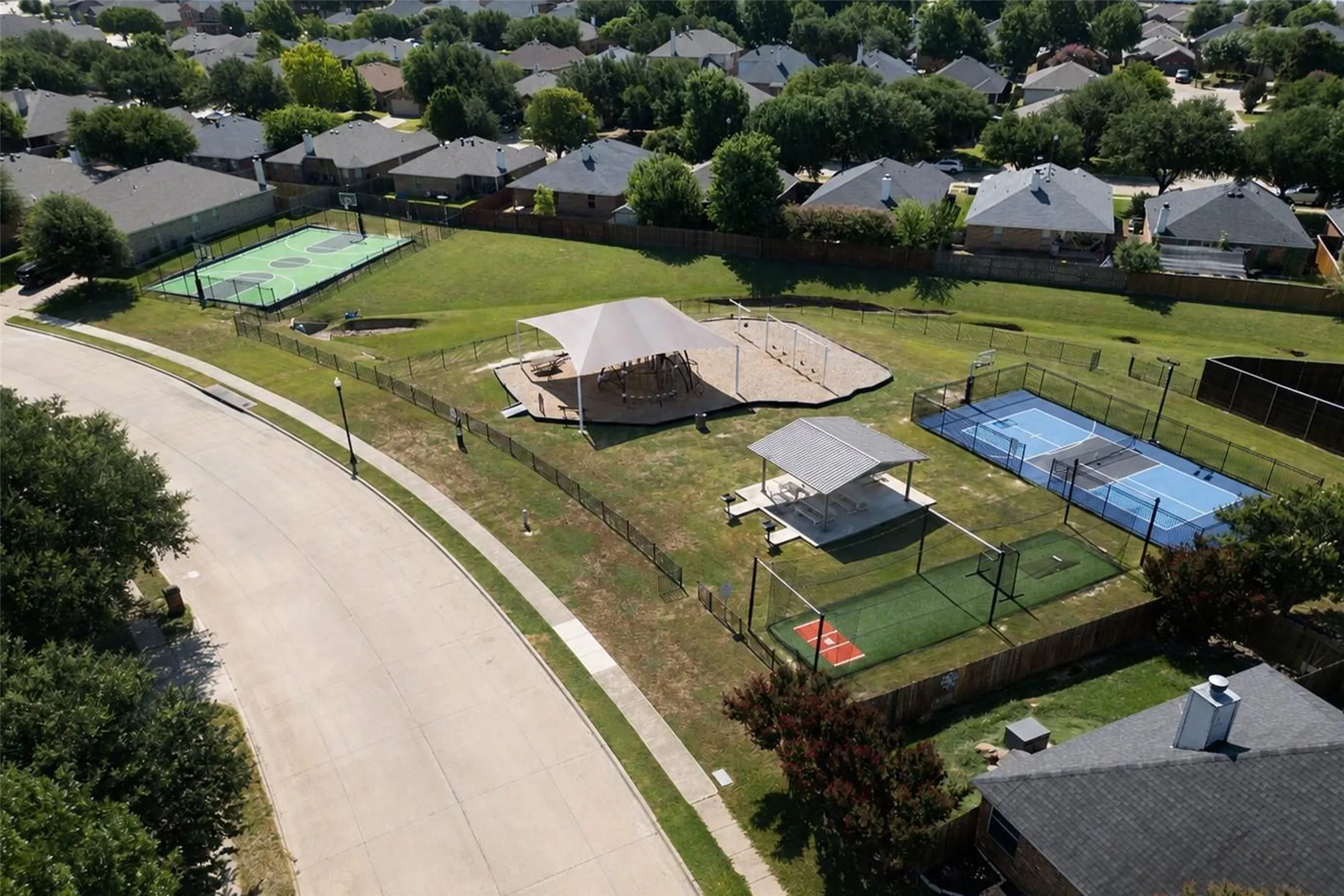 Community playground, pickleball court, basketball court and batting cage