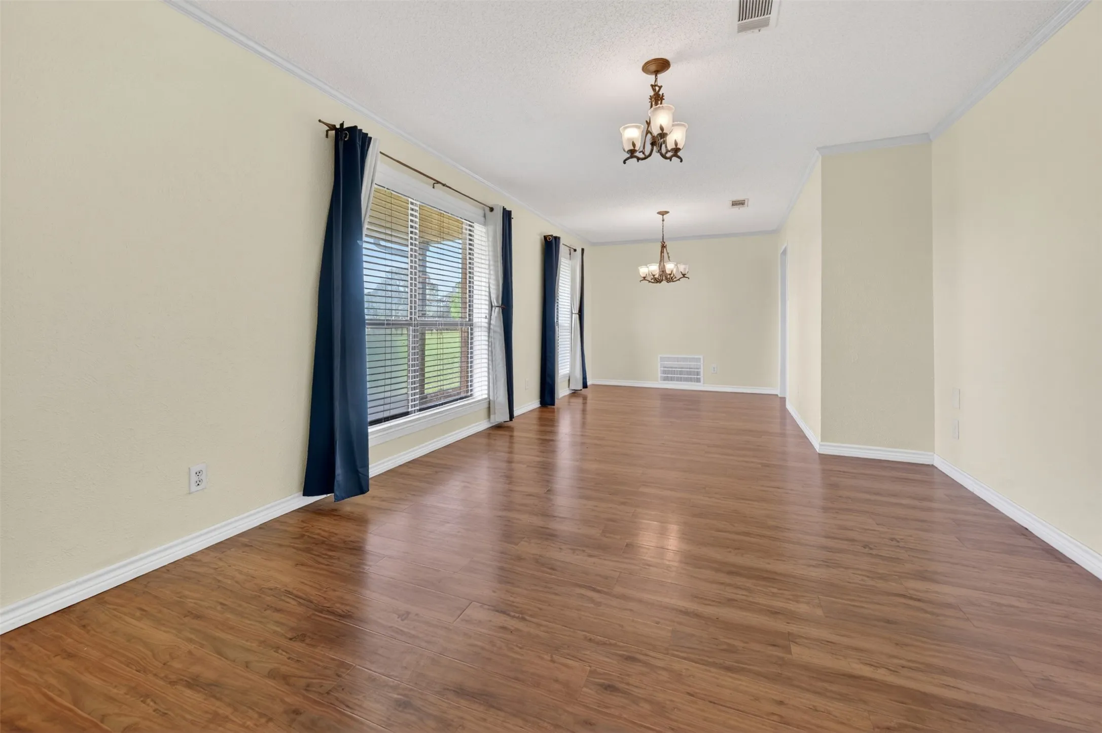 Formal living/dining room combined room at the front of the home