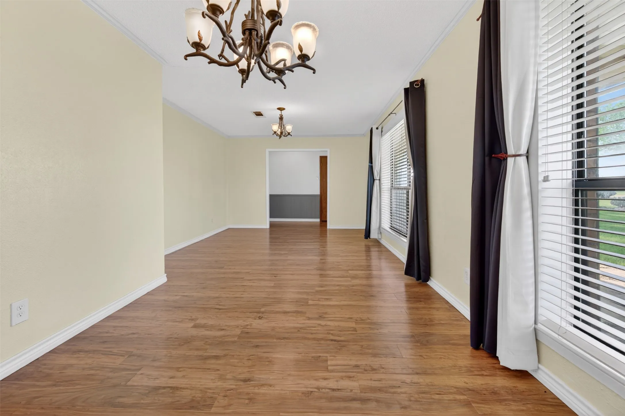 Formal living/dining room combined room at the front of the home