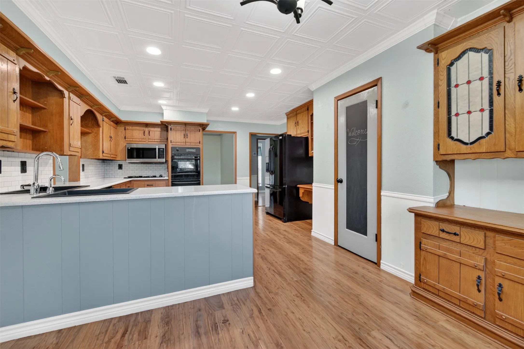 View into the kitchen from the breakfast room. Note the large pantry