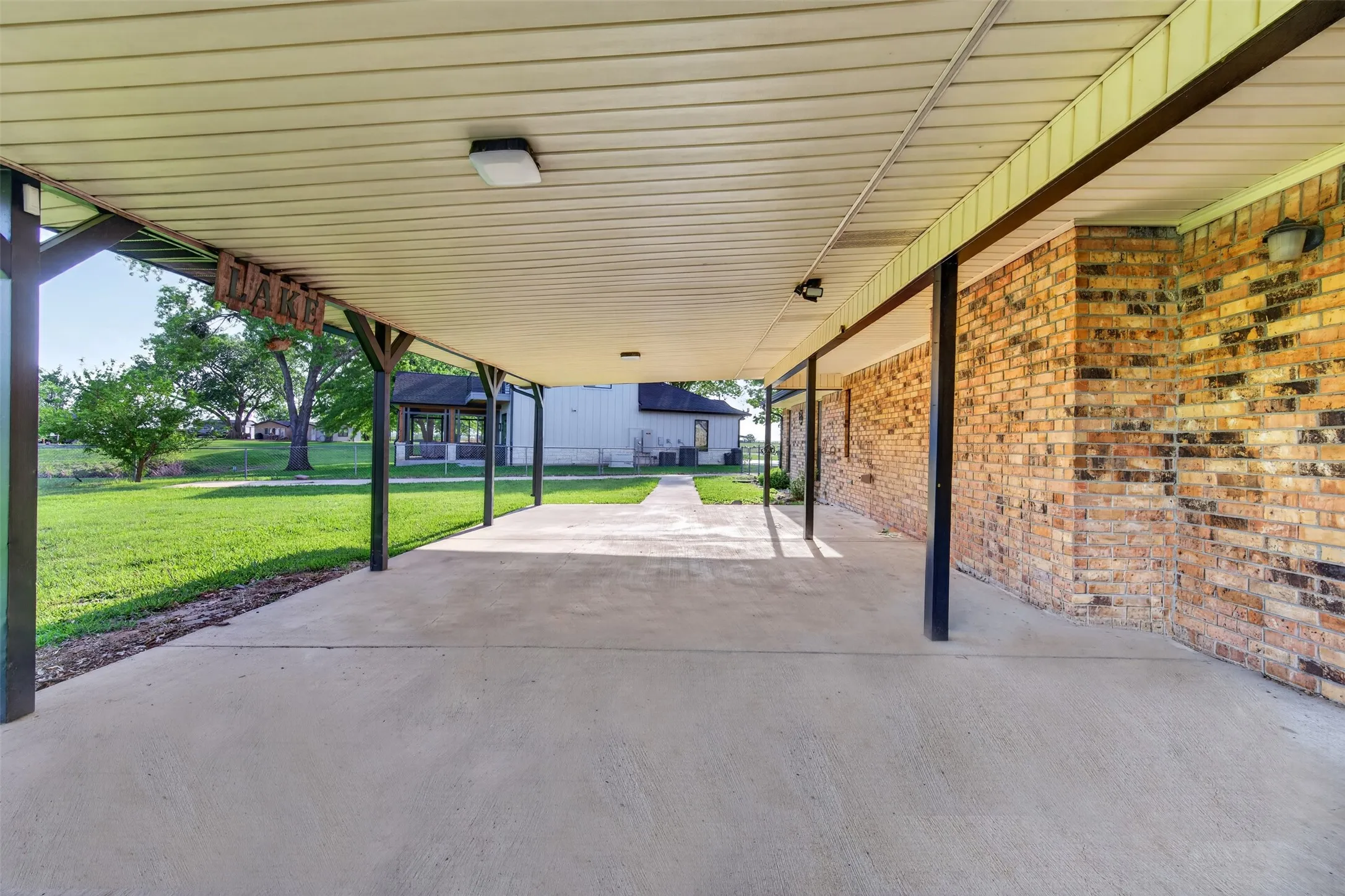 Huge covered patio looks out to the back yard