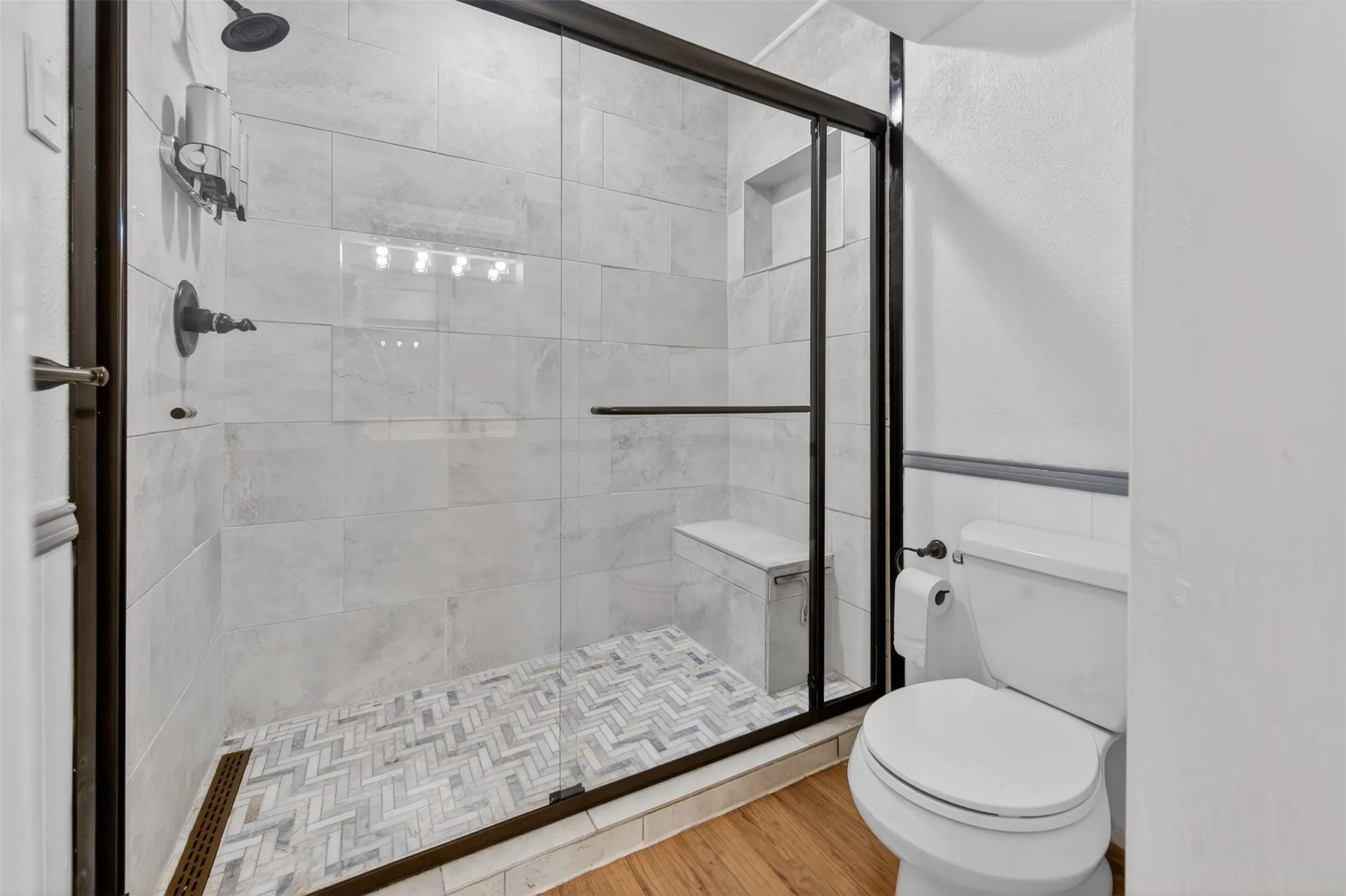 Primary bathroom has an updated shower