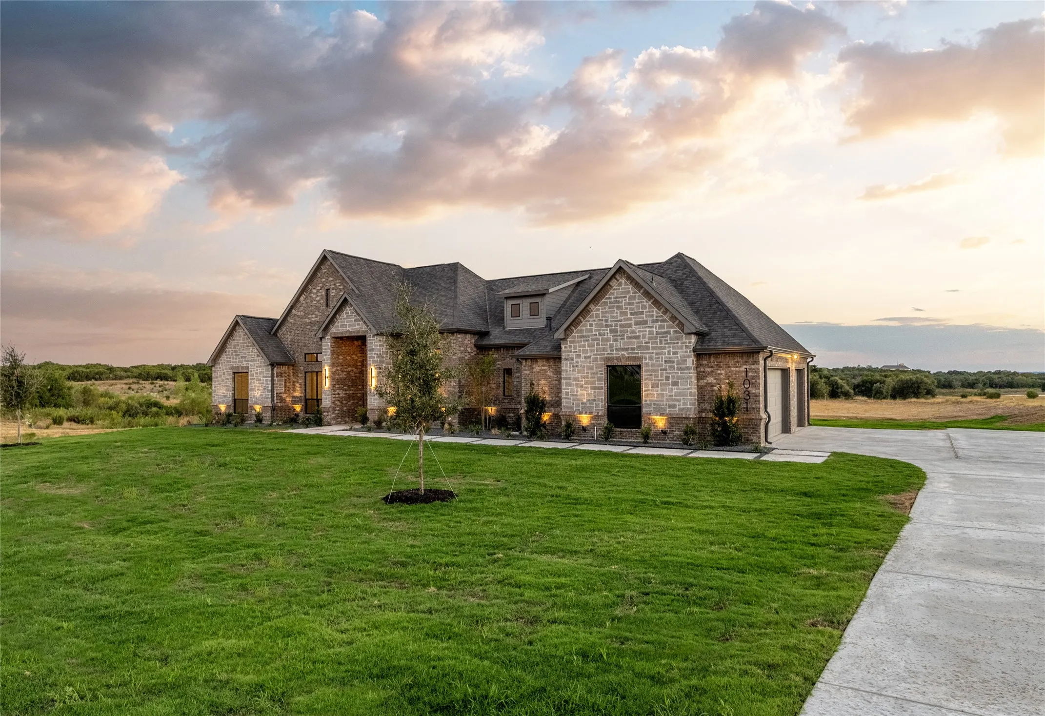 Stone and brick exterior with a multi-gabled roofline