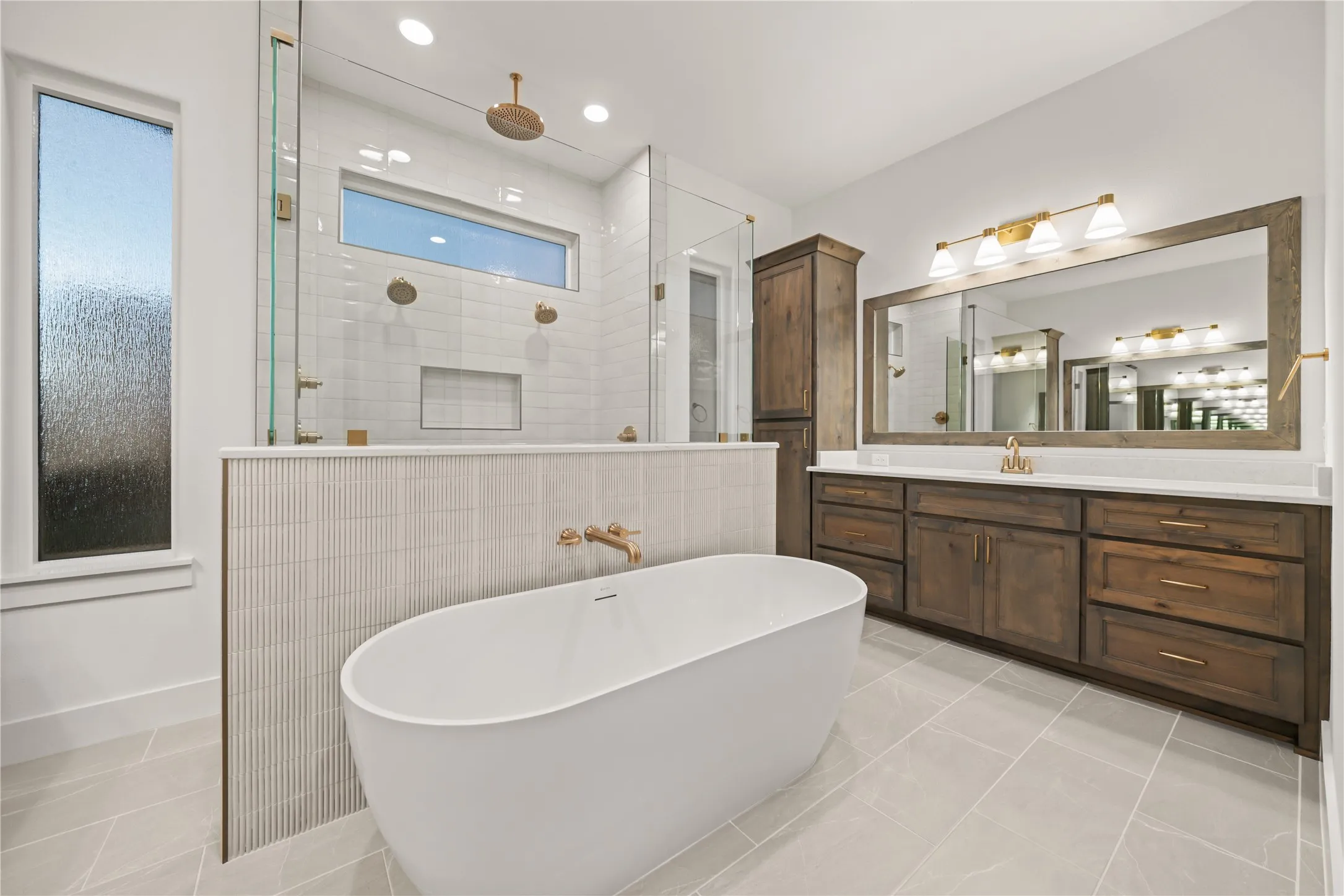 Freestanding soaking tub with wall-mounted faucet
