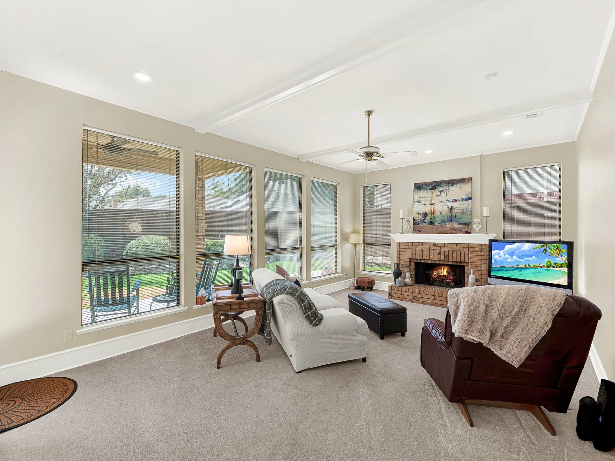 Flow straight into the comfortable living room with gas starter fireplace.