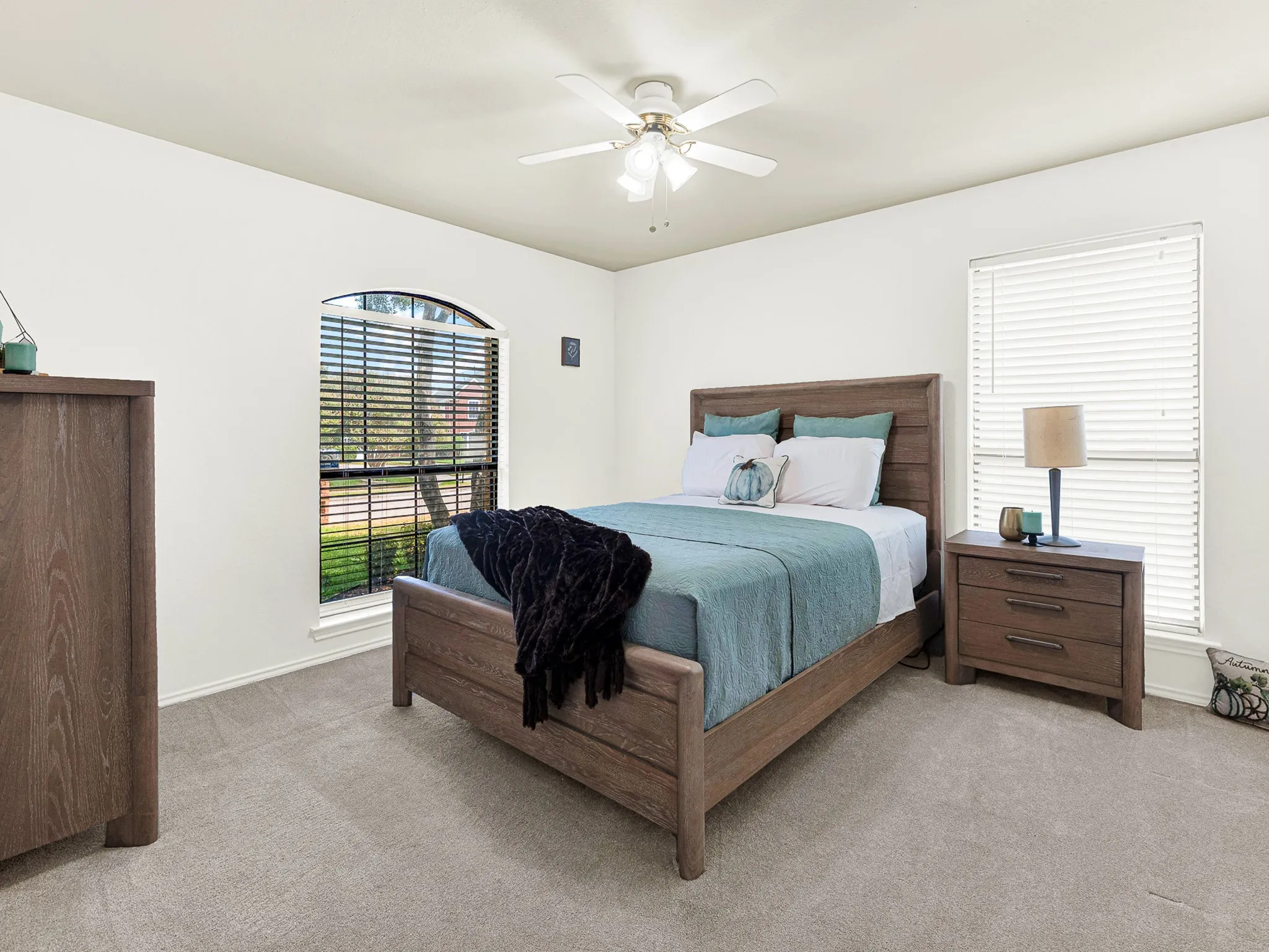 Large second bedroom with  lots of natural light to welcome you into this space.