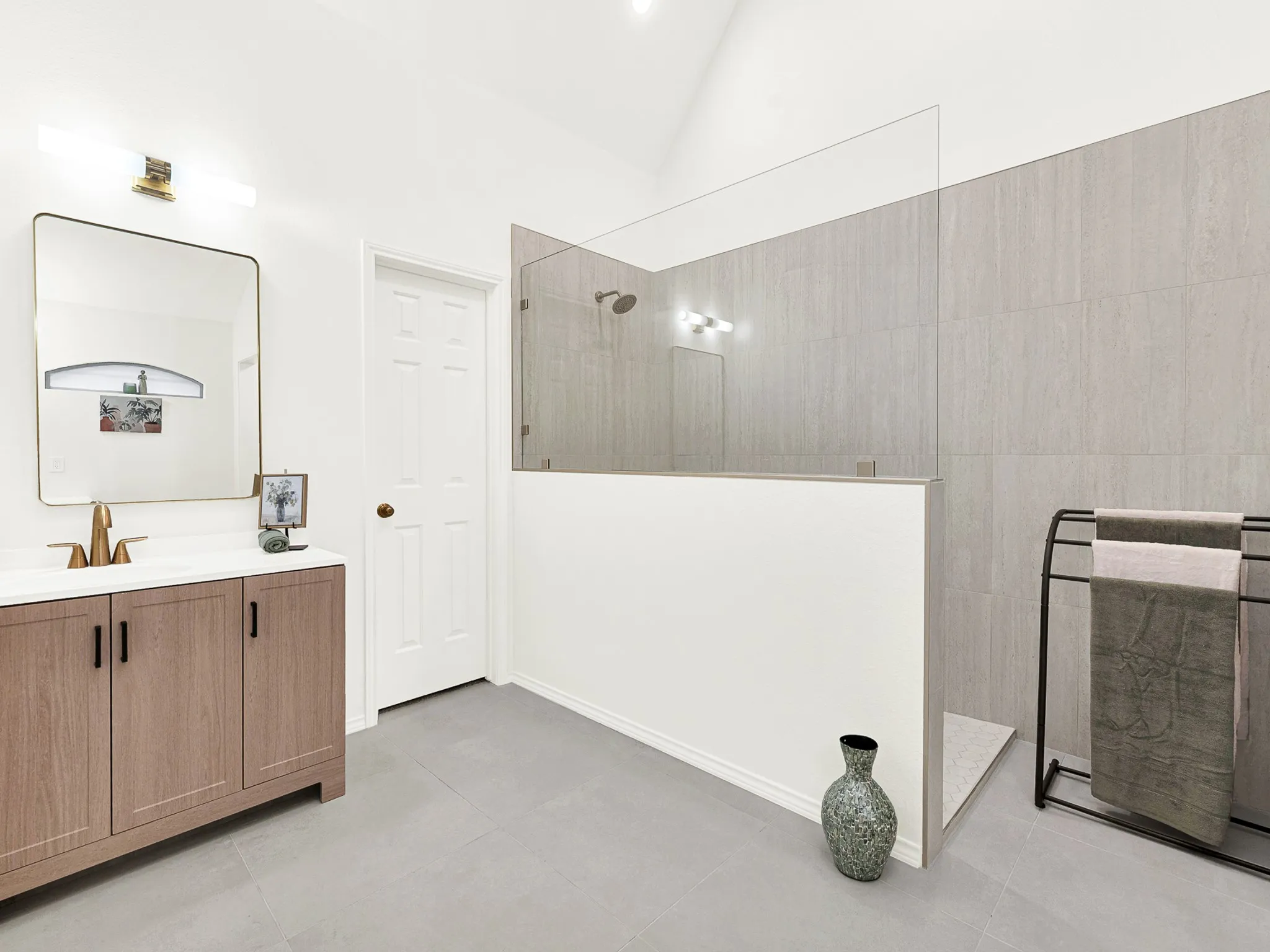 Welcome to your completely renovated primary bathroom spa, with walk in shower  separate vanities & large walk in closet.