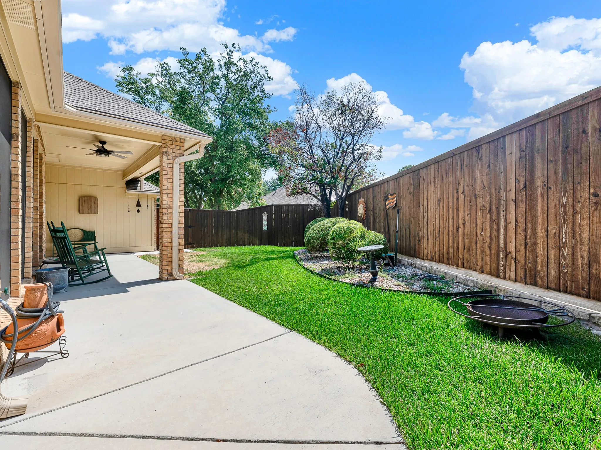 The patio wraps around the side of house for entertaining or storage. Patio was resently replaced along with drainage system for house.