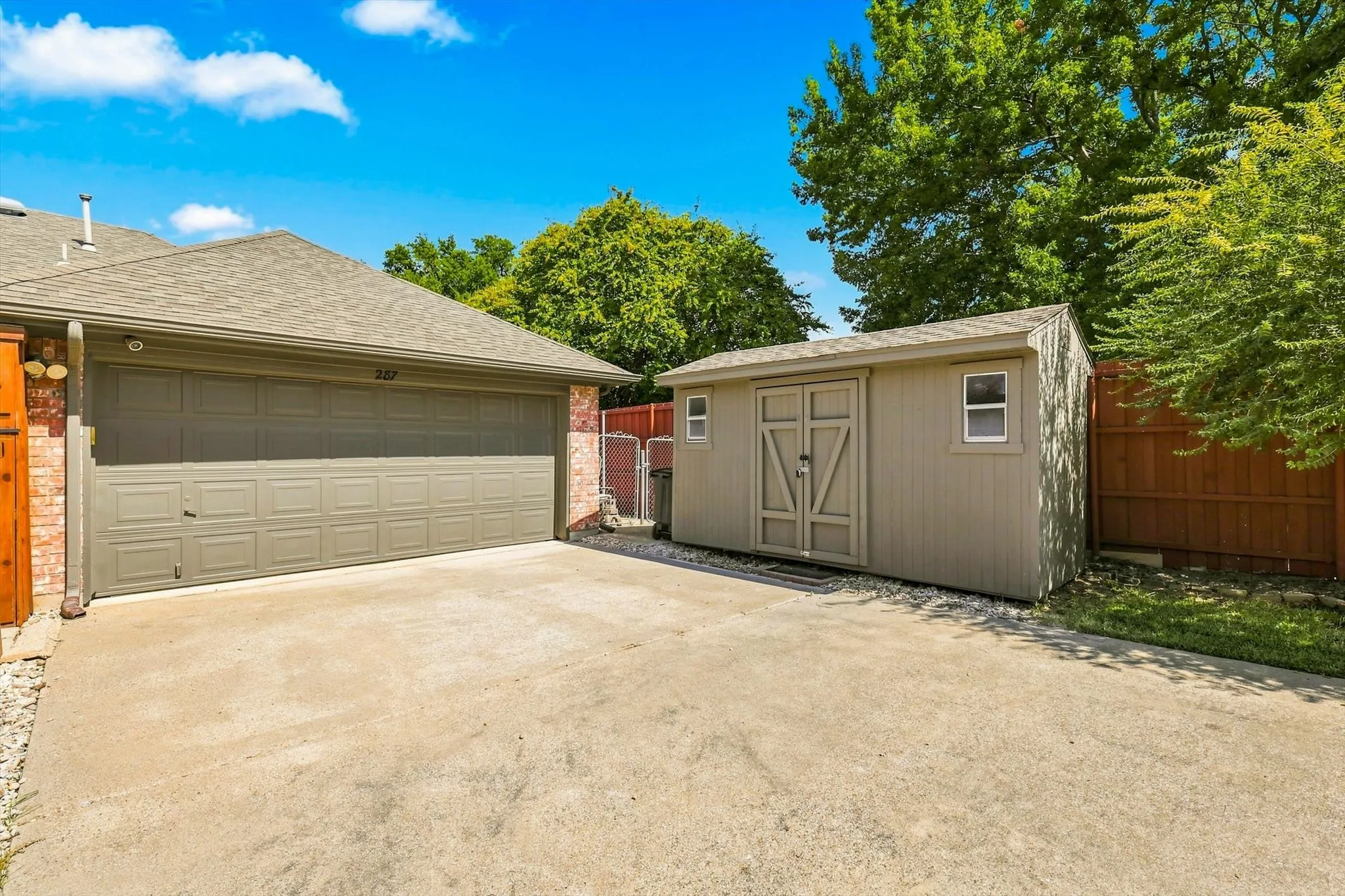Good Size Driveway & Large Storage Shed