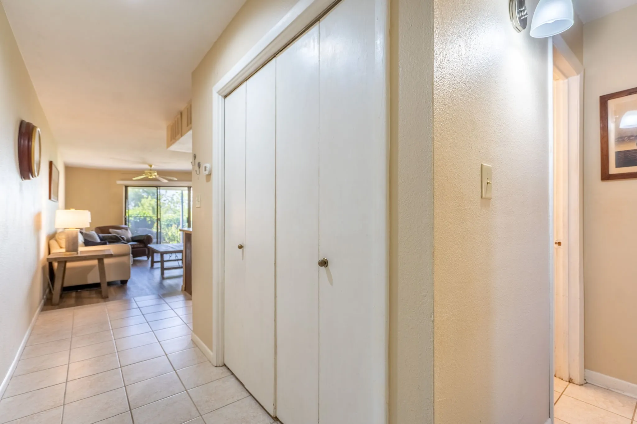 Tile flooring extending into the hallway