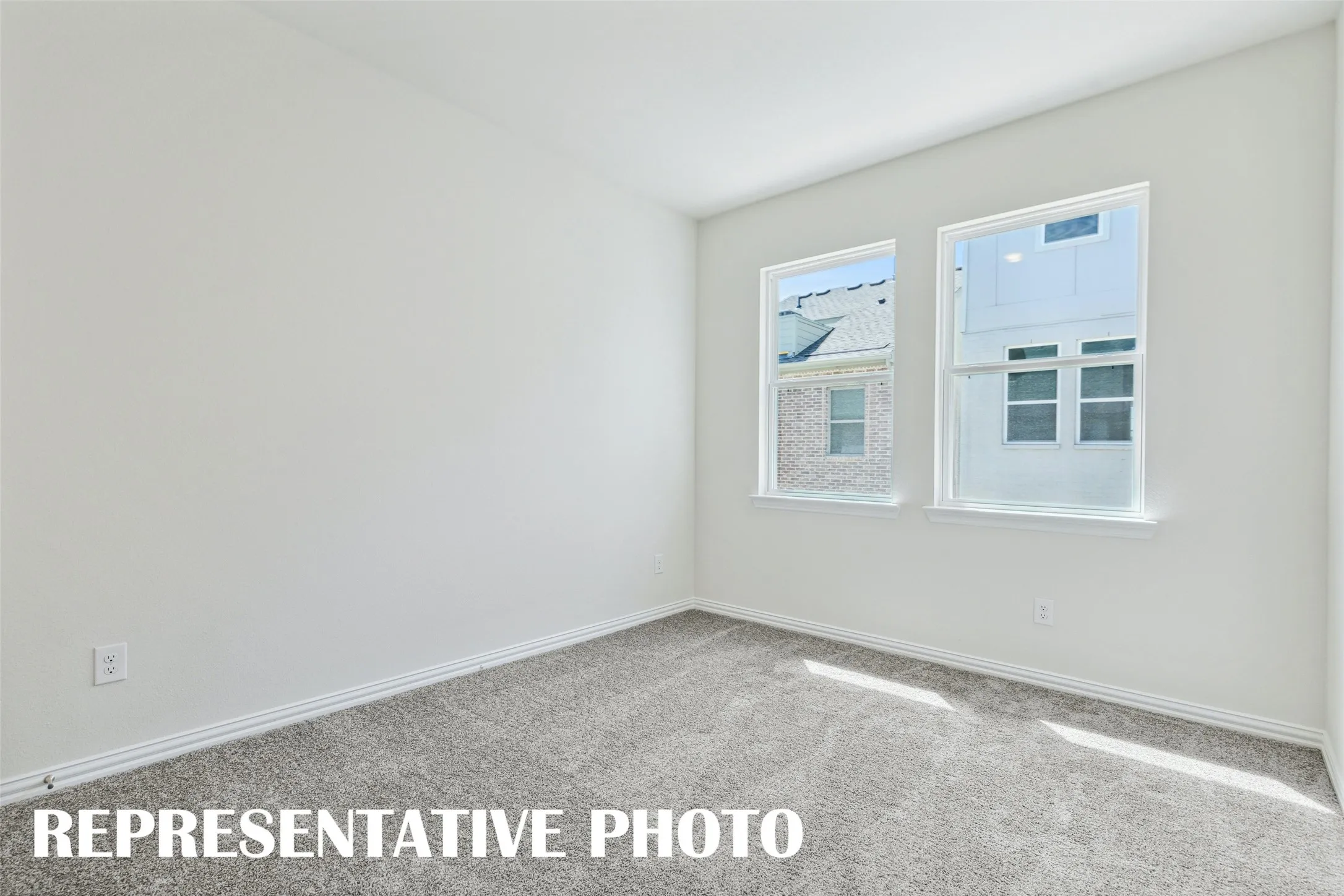 You'll find nicely sized secondary bedrooms in our Zoe floor plan.  REPRESENTATIVE PHOTO