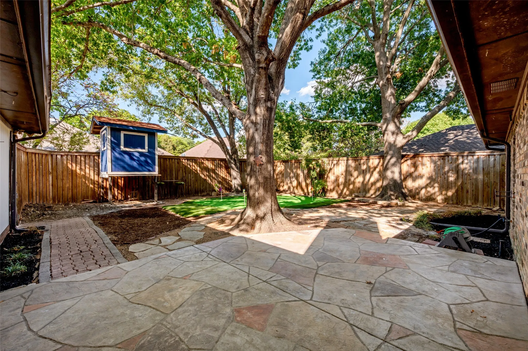 Extended Patio with Large Shade Trees
